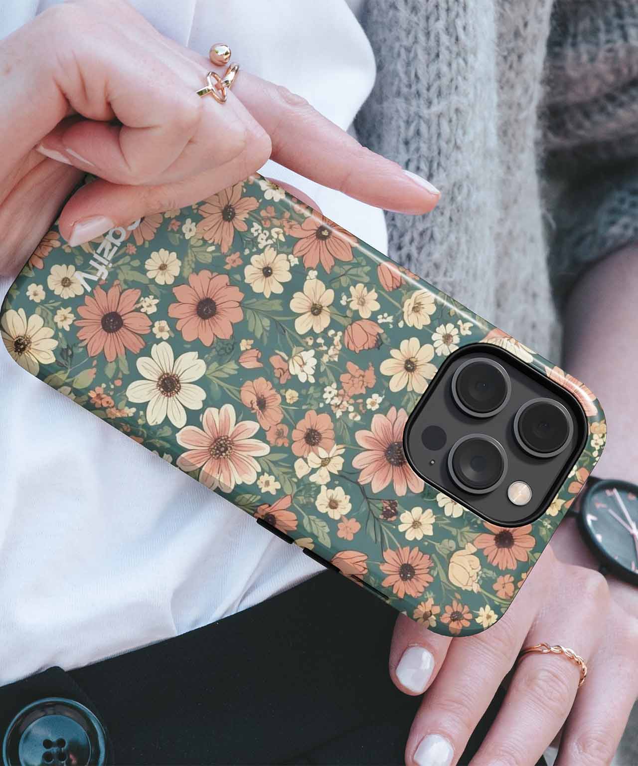 Green floral iPhone case with orange and yellow flowers, held in hand. - Blooming Floral Fantasy Dance iPhone case - Cazify Canada