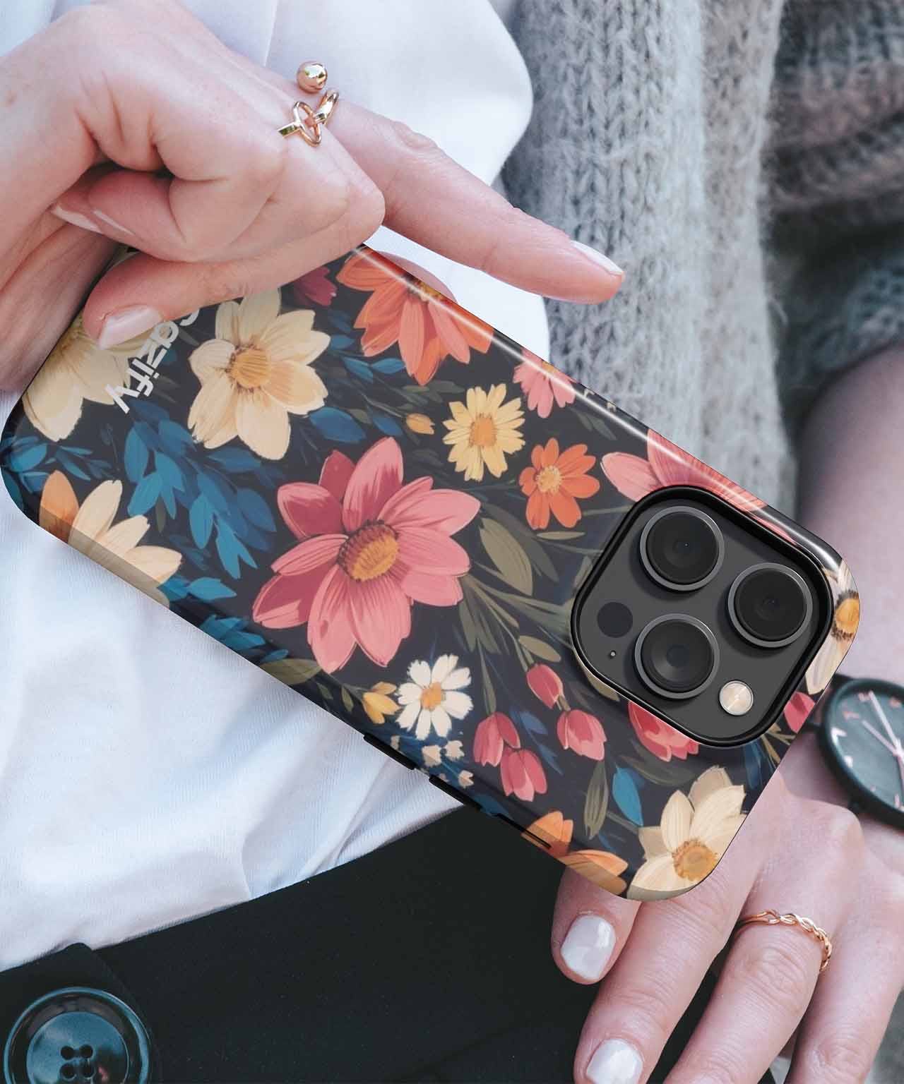 Floral patterned iPhone case with large camera cutout held in hand. - Blooming Garden Party Extravaganza iPhone case - Cazify Canada