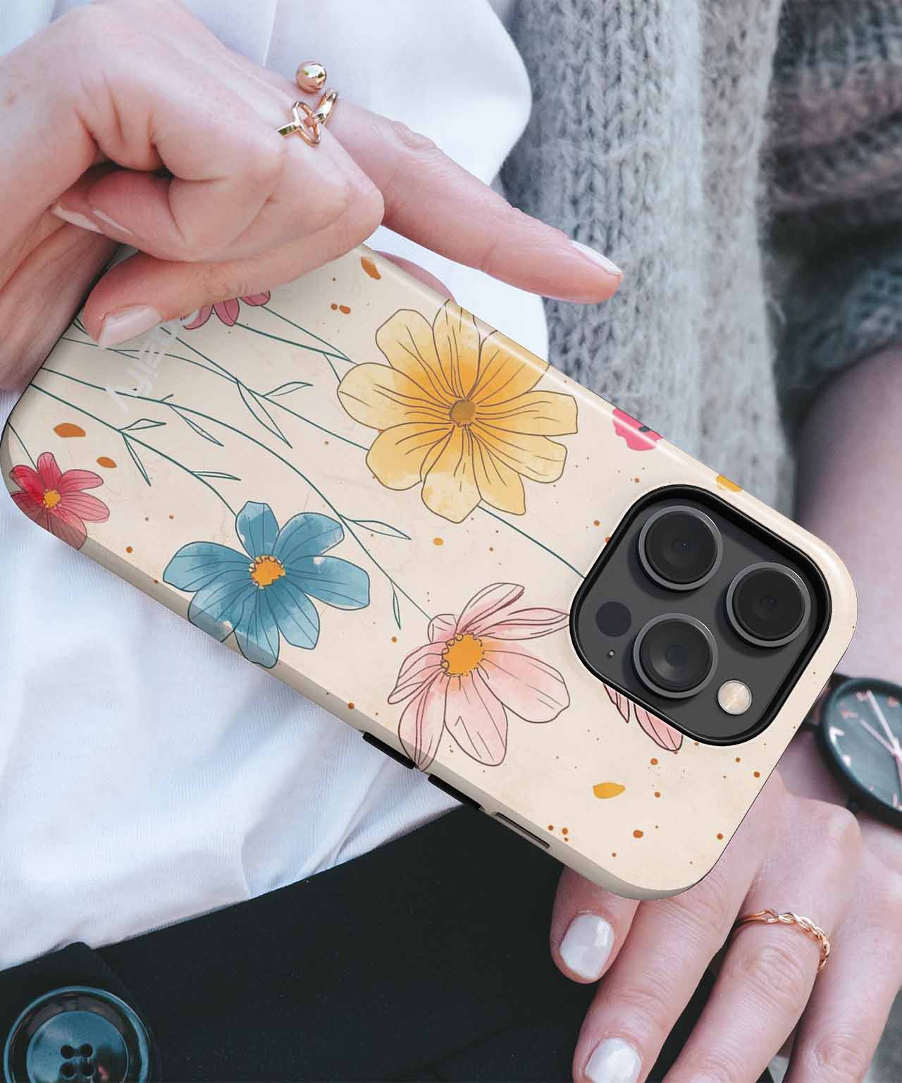 Floral design iPhone case with yellow, blue, and pink flowers on beige background. - Blossoming Delightful Garden Blooms iPhone case - Cazify Canada