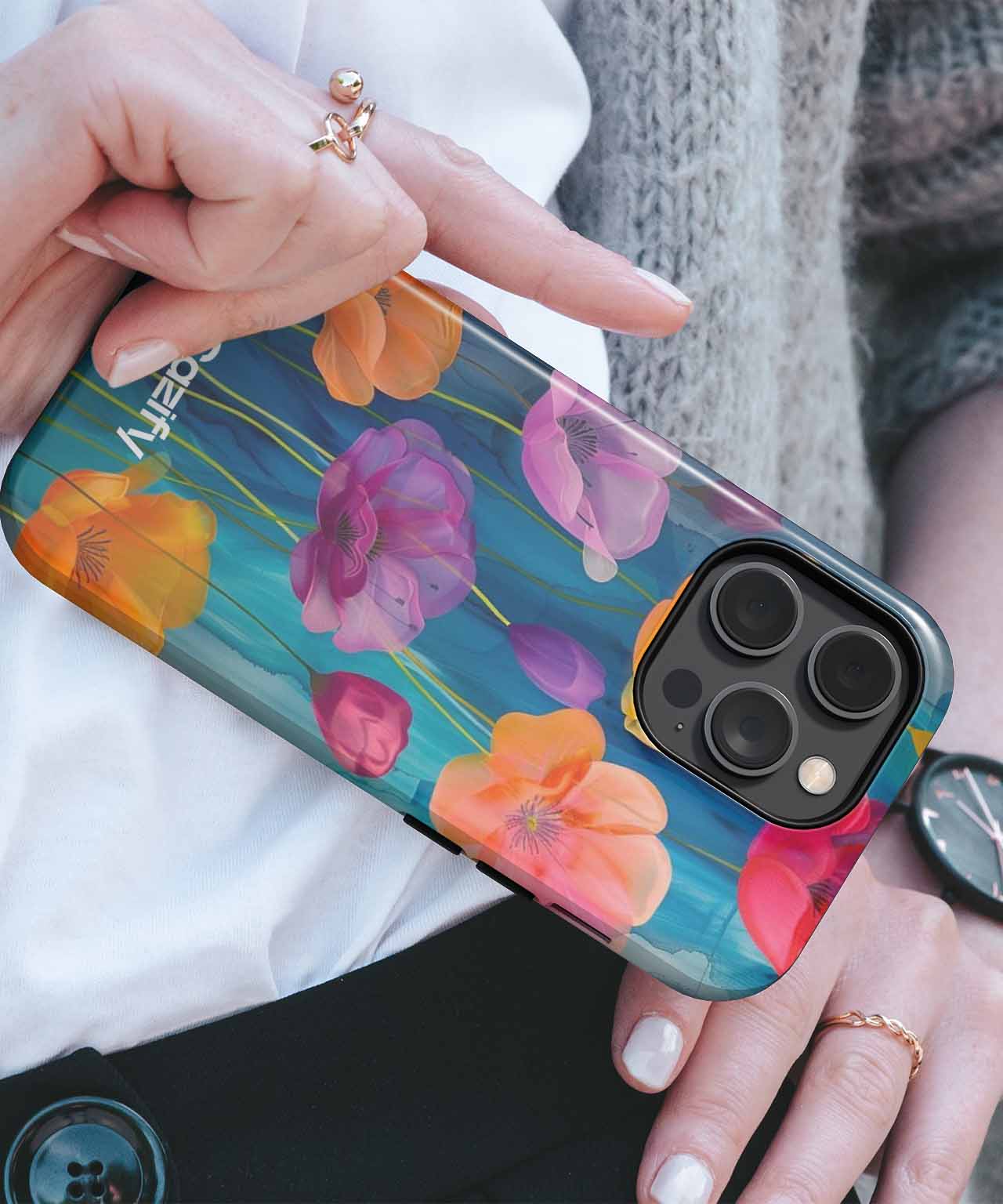 Floral pattern iPhone Case with pink and orange flowers on a teal background. - Brightly Colored Floral Fiesta iPhone case - Cazify Canada