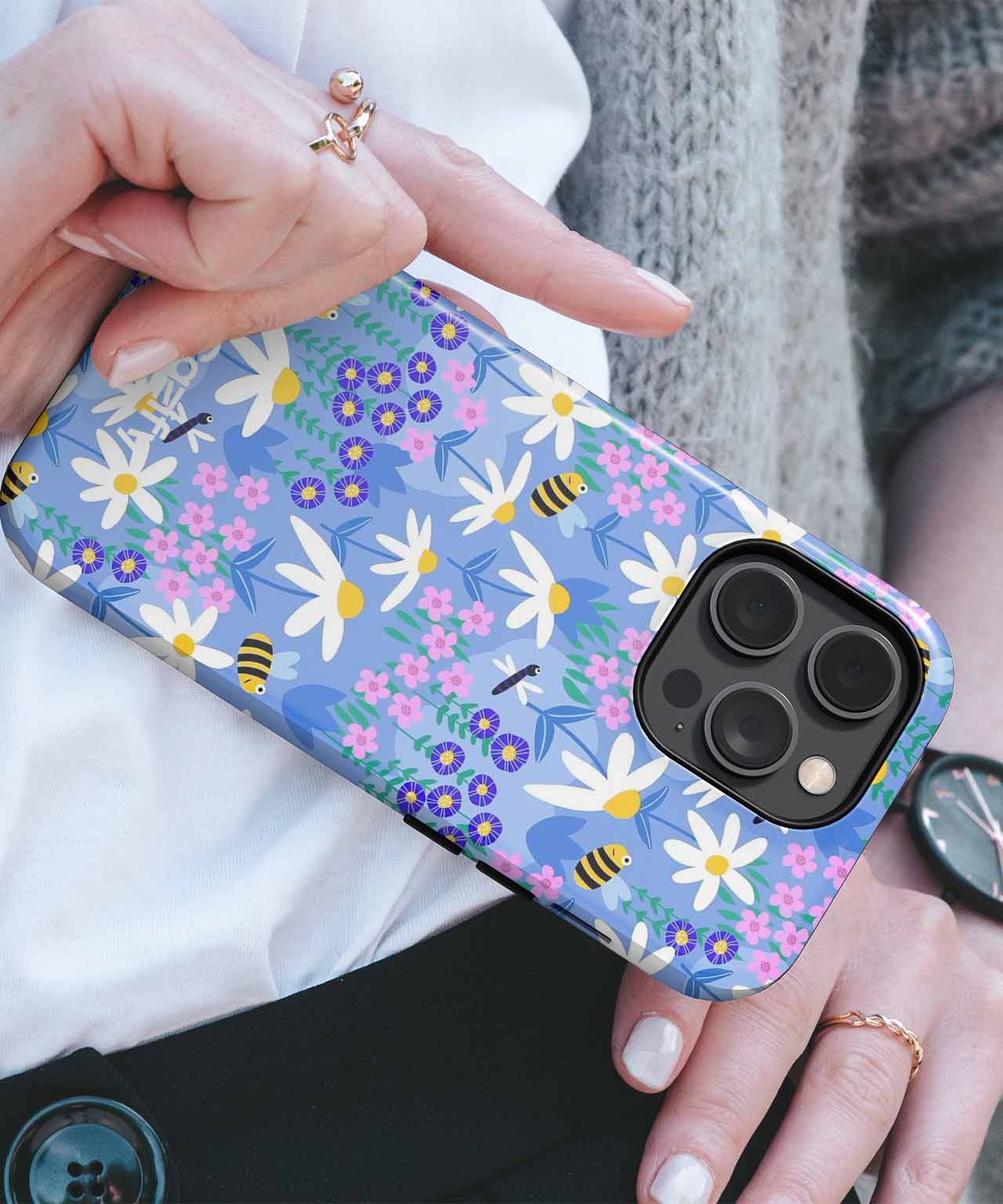 Blue phone case with white daisies and purple flowers, compatible with multiple iPhone models. - Cazify Canada