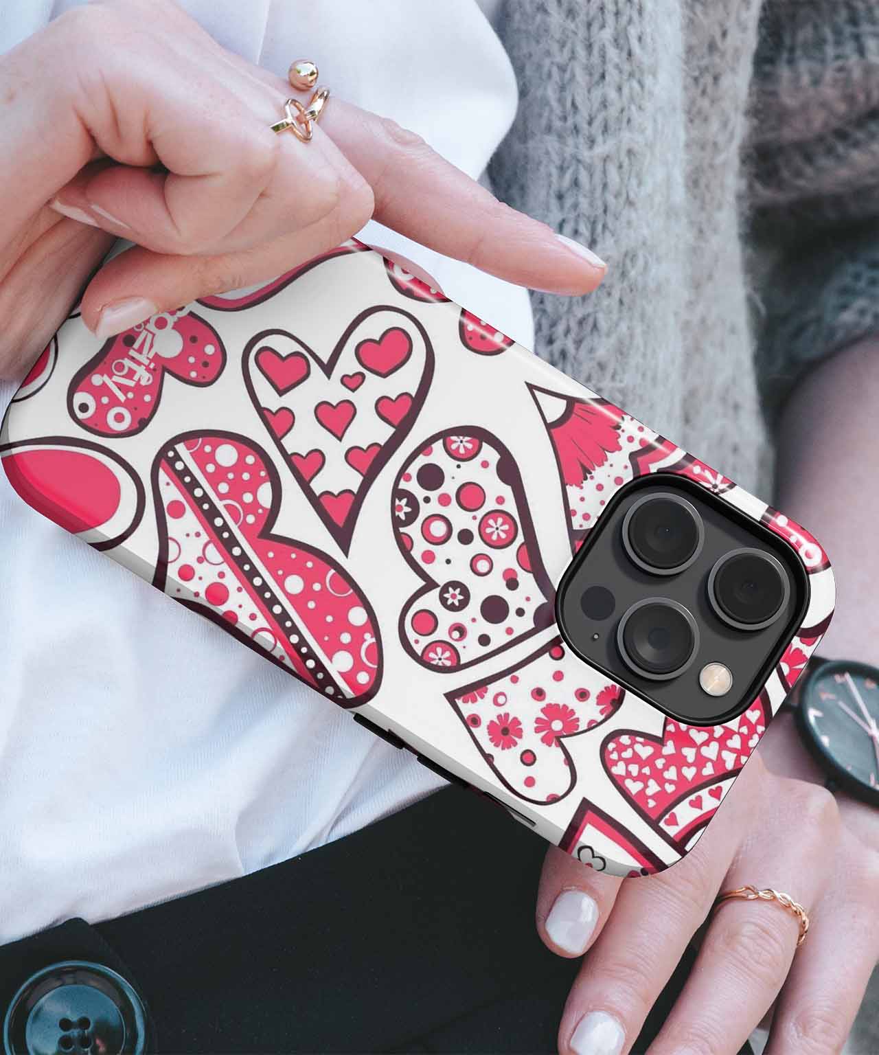 White iPhone case with red and pink heart and polka dot patterns. - Cazify Canada