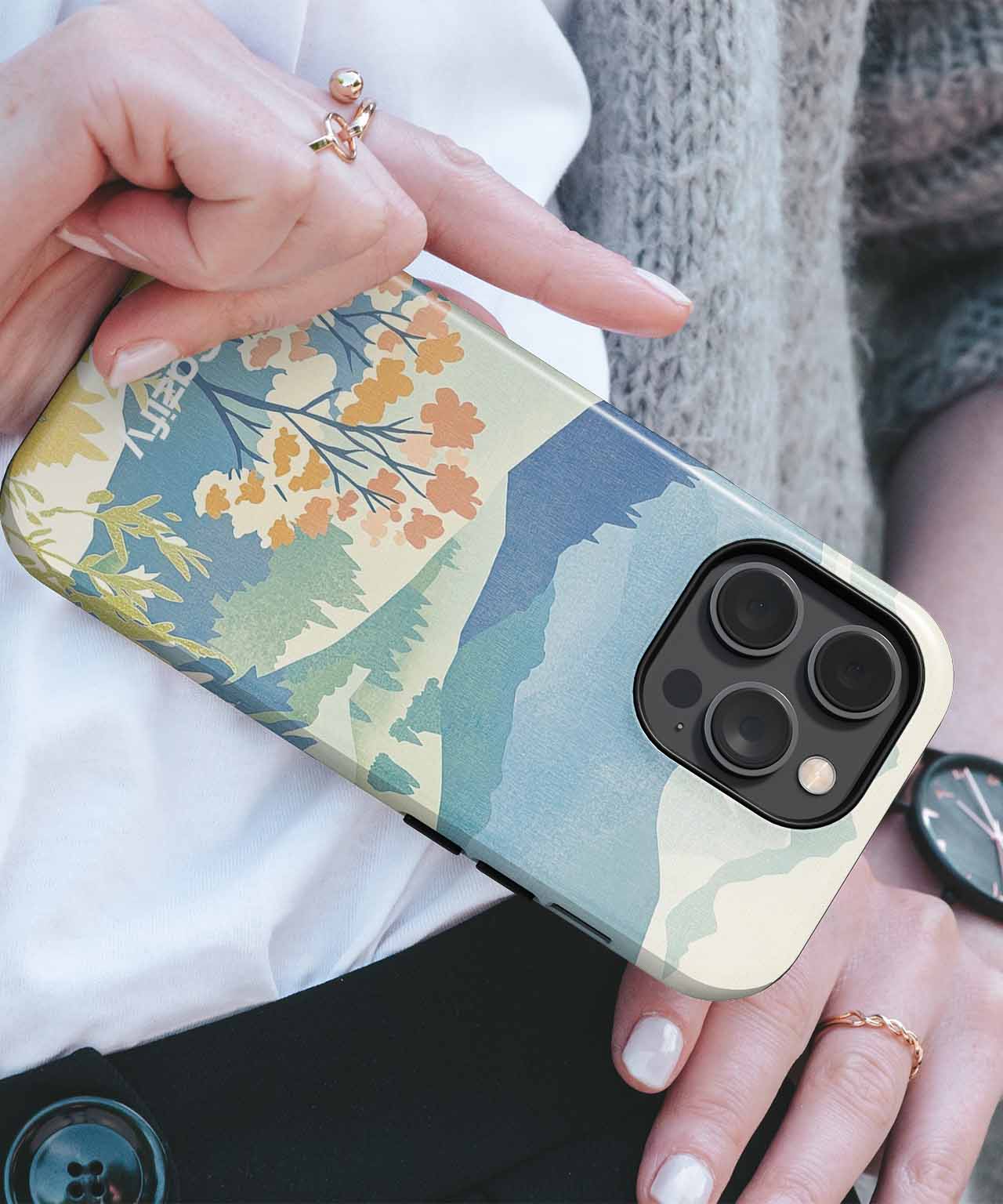 Cazify Canada - Floral and mountain landscape design phone case on black iPhone with triple camera lenses.