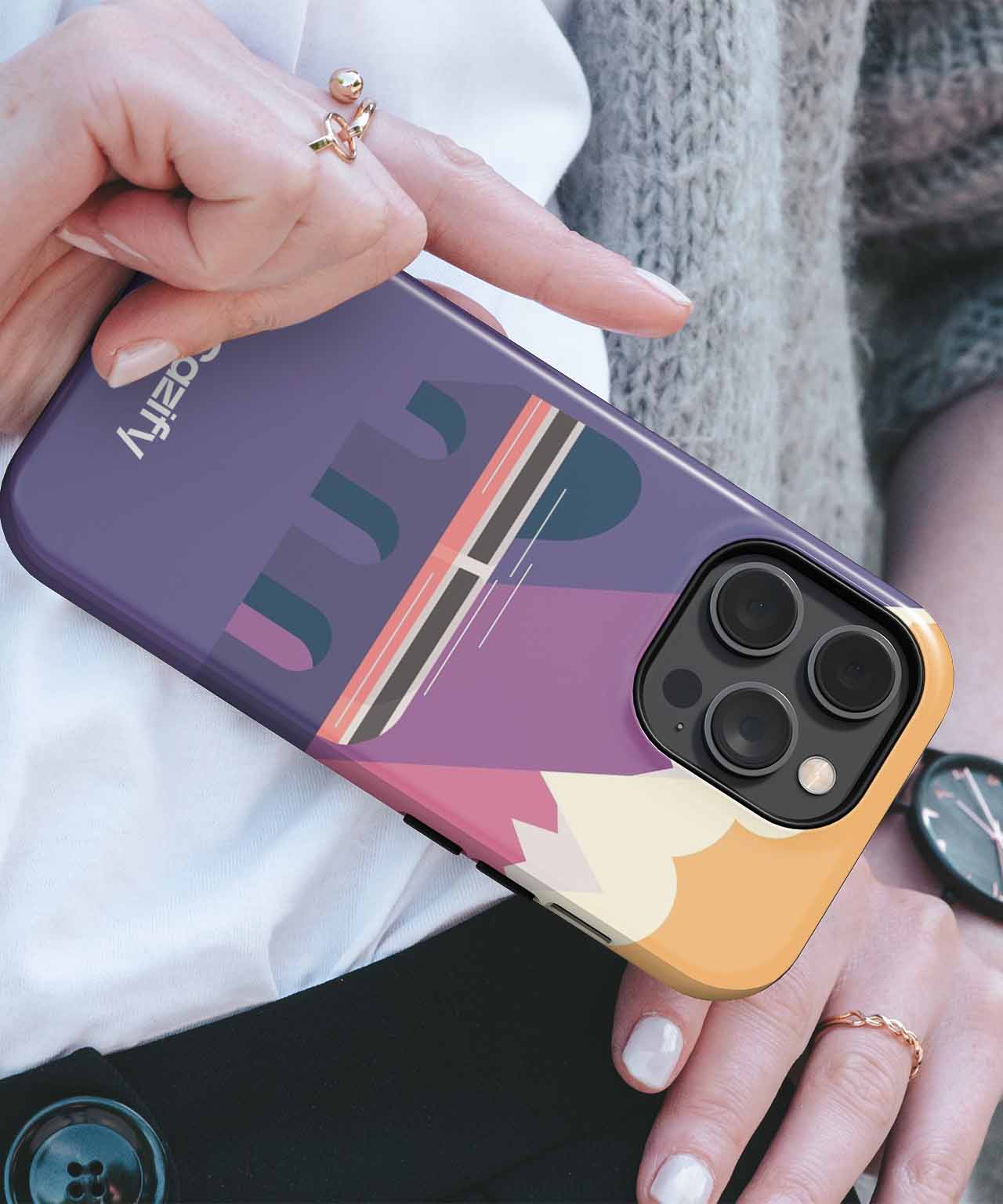 Cazify Canada - Purple and orange abstract geometric design phone case on iPhone with triple camera lenses.