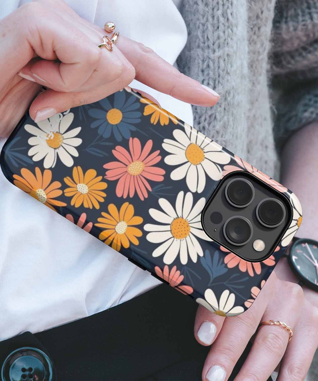 Floral pattern iPhone case with white, yellow, and orange daisies on black background. - Cheerful Blooming Daisy Garden iPhone case - Cazify Canada