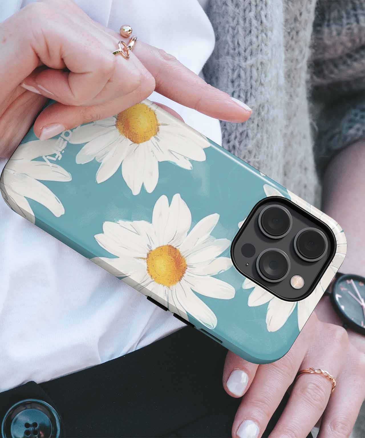 Blue iPhone Case with large white daisies and yellow centers covering the back. - Cheerful Daisies Dance in Sunshine iPhone case - Cazify Canada