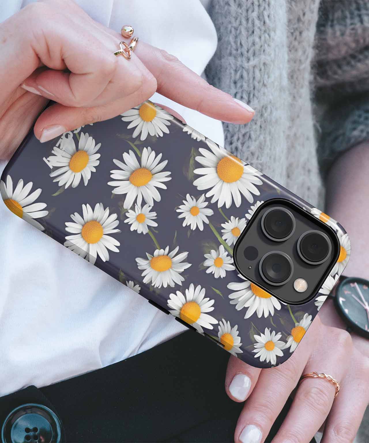 Black iPhone case with white and yellow daisy flower pattern on a gold iPhone Pro model. - Cheerful Daisy Delightful Bouquet iPhone case - Cazify Canada