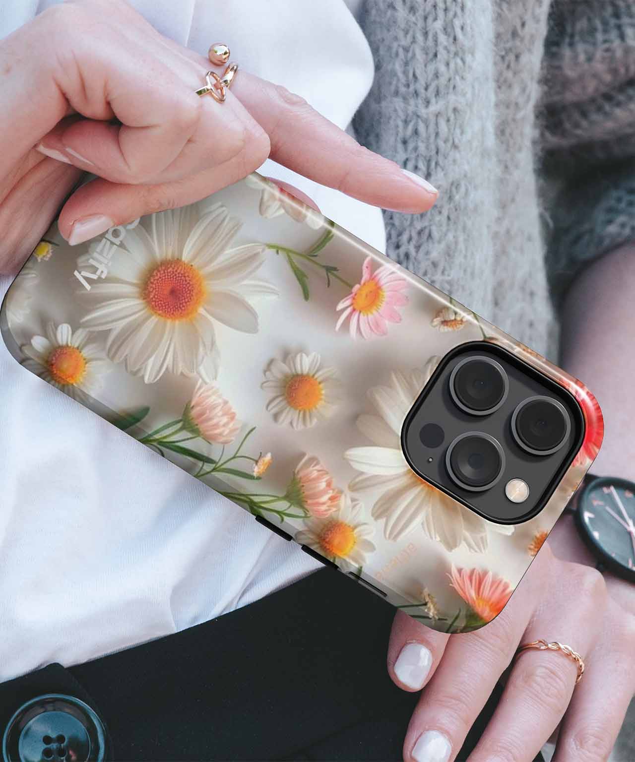 Clear iPhone case with white and orange daisy floral design and black camera cutout. - Cazify Canada