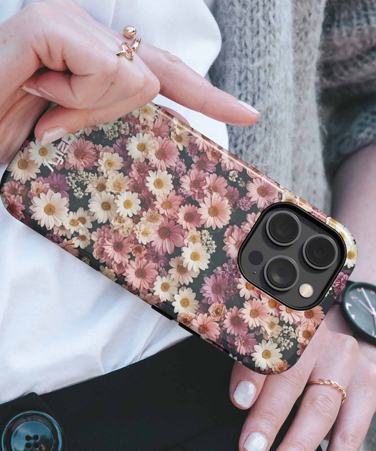 Floral pattern phone case with pink, yellow, and white daisy design on black background. - Cazify Canada