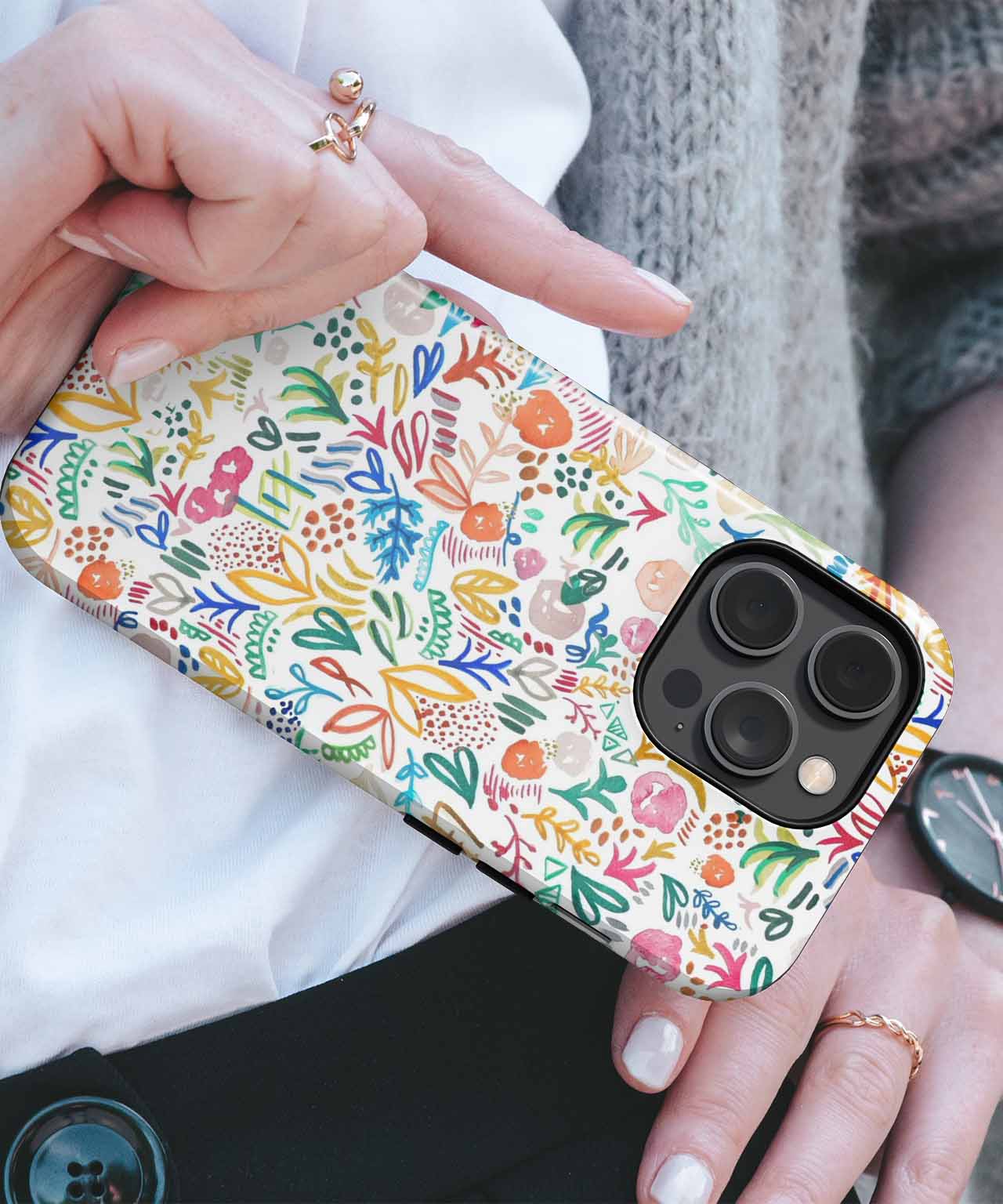 Floral-patterned protective phone case with multicolored flowers on white background. - Cazify Canada