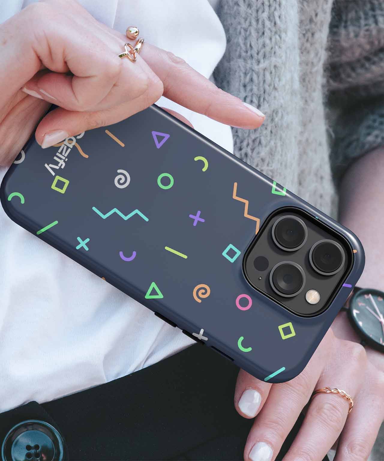 Black iPhone case with colorful neon geometric shapes and patterns. - Cazify Canada