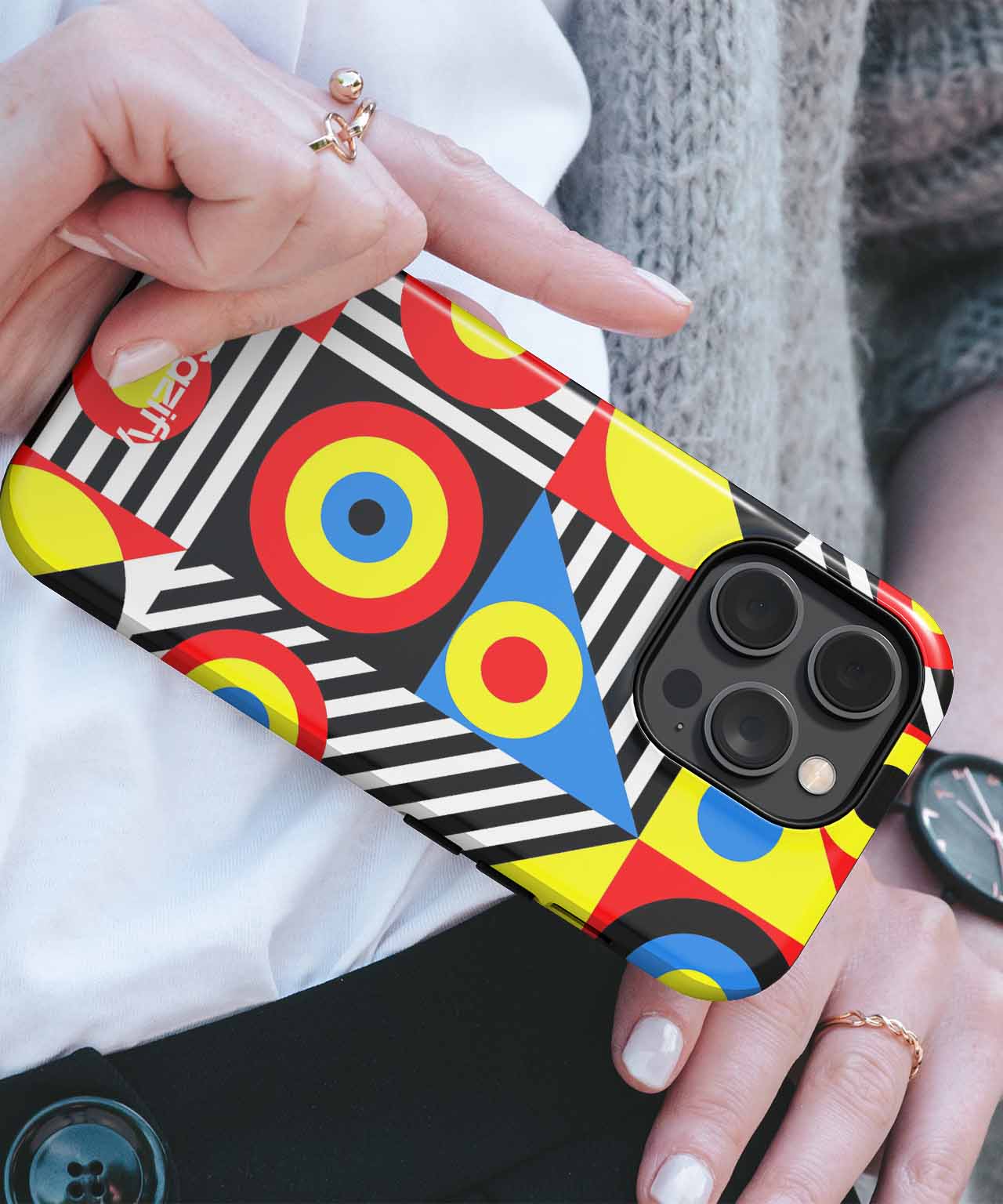 Colorful geometric pattern phone case with red, yellow, blue circles and black-white stripes on iPhone. - Cazify Canada