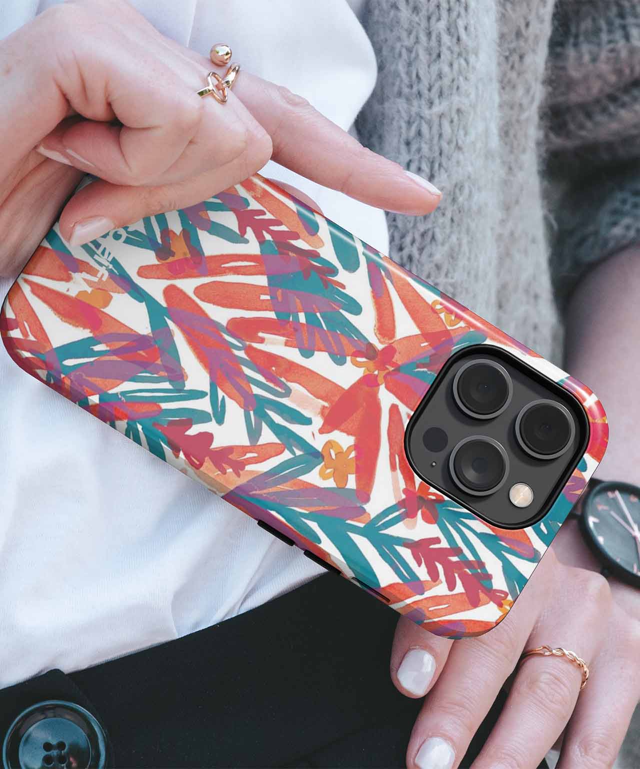 Colorful abstract leaf pattern phone case on black iPhone with triple camera lenses. - Cazify Canada