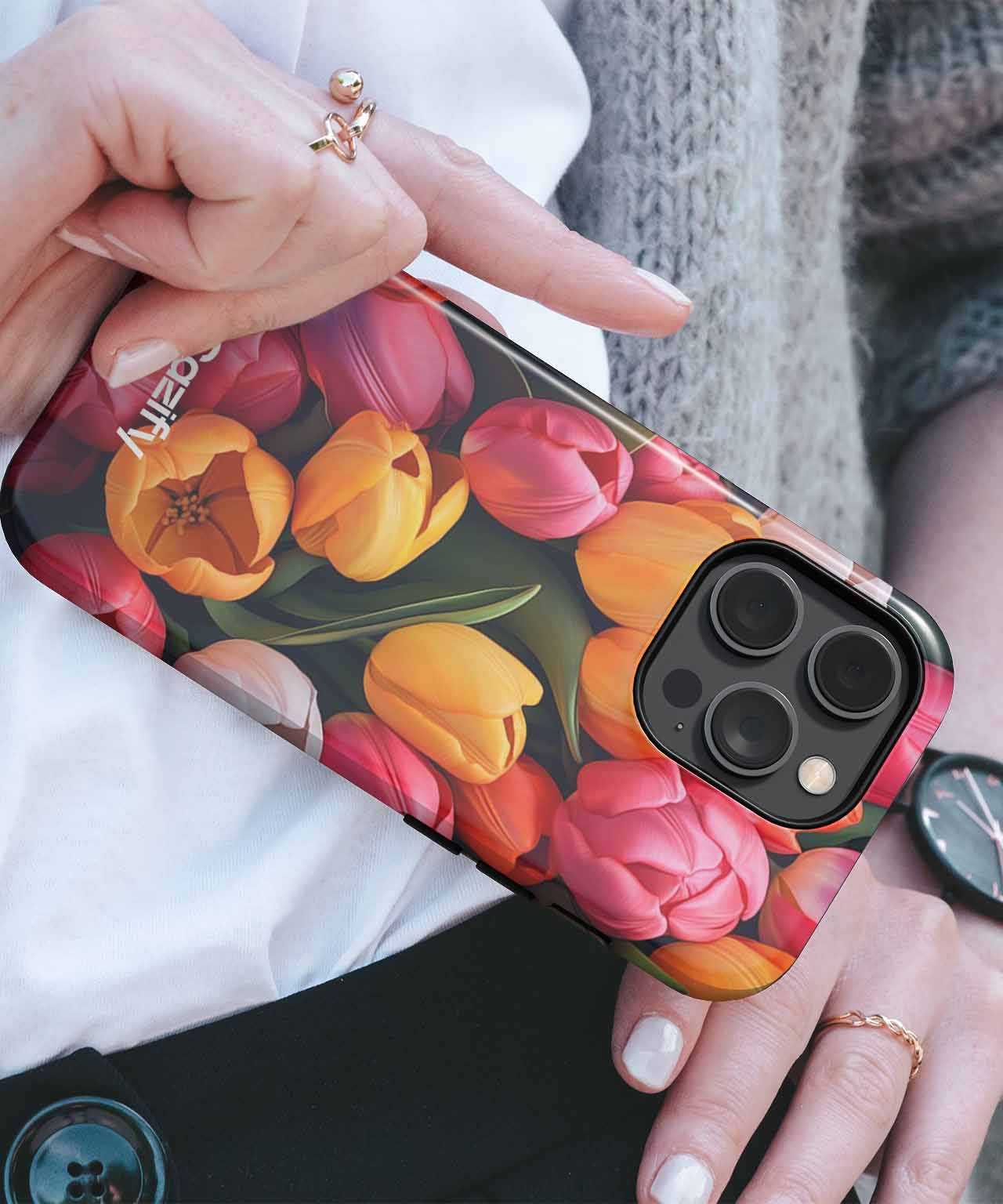 Floral tulip pattern iPhone case with black edges on a smartphone. - Colorful Tulip Party in a Garden iPhone case - Cazify Canada