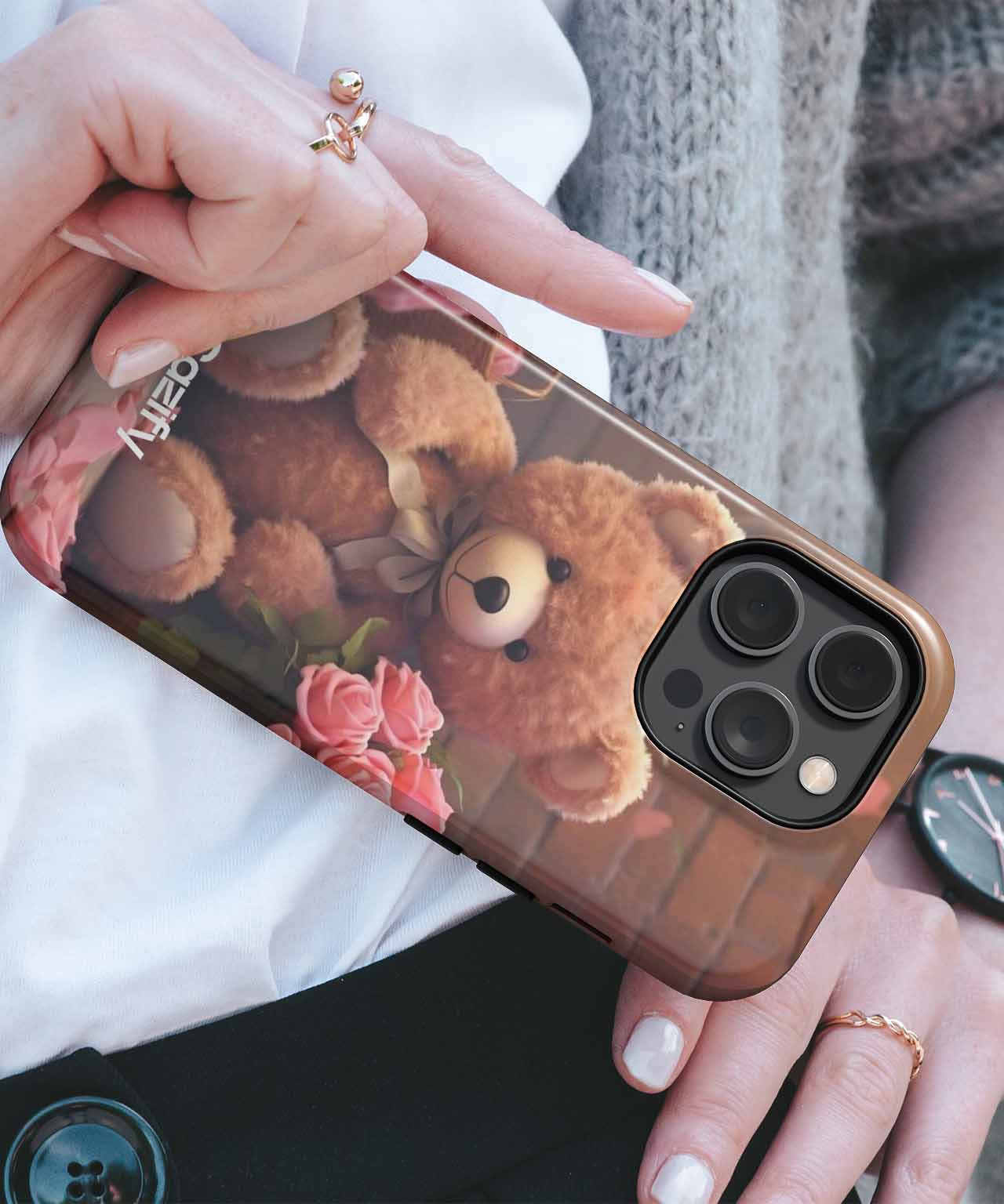 Brown teddy bear and pink roses printed iPhone case with black camera cutout and gold edges. - Cazify Canada