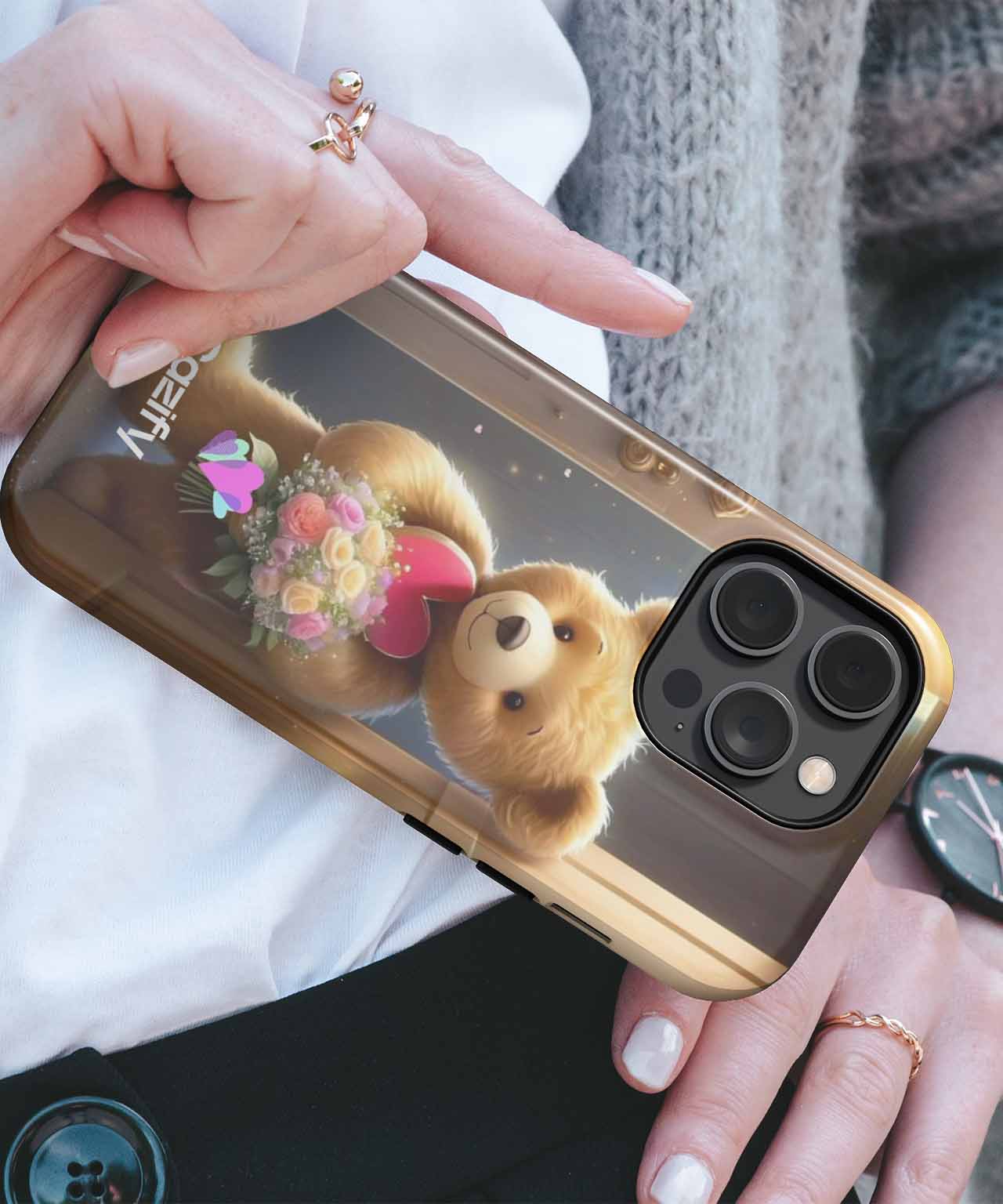 Glossy brown iPhone case with teddy bear holding flowers design and gold edges. - Cazify Canada