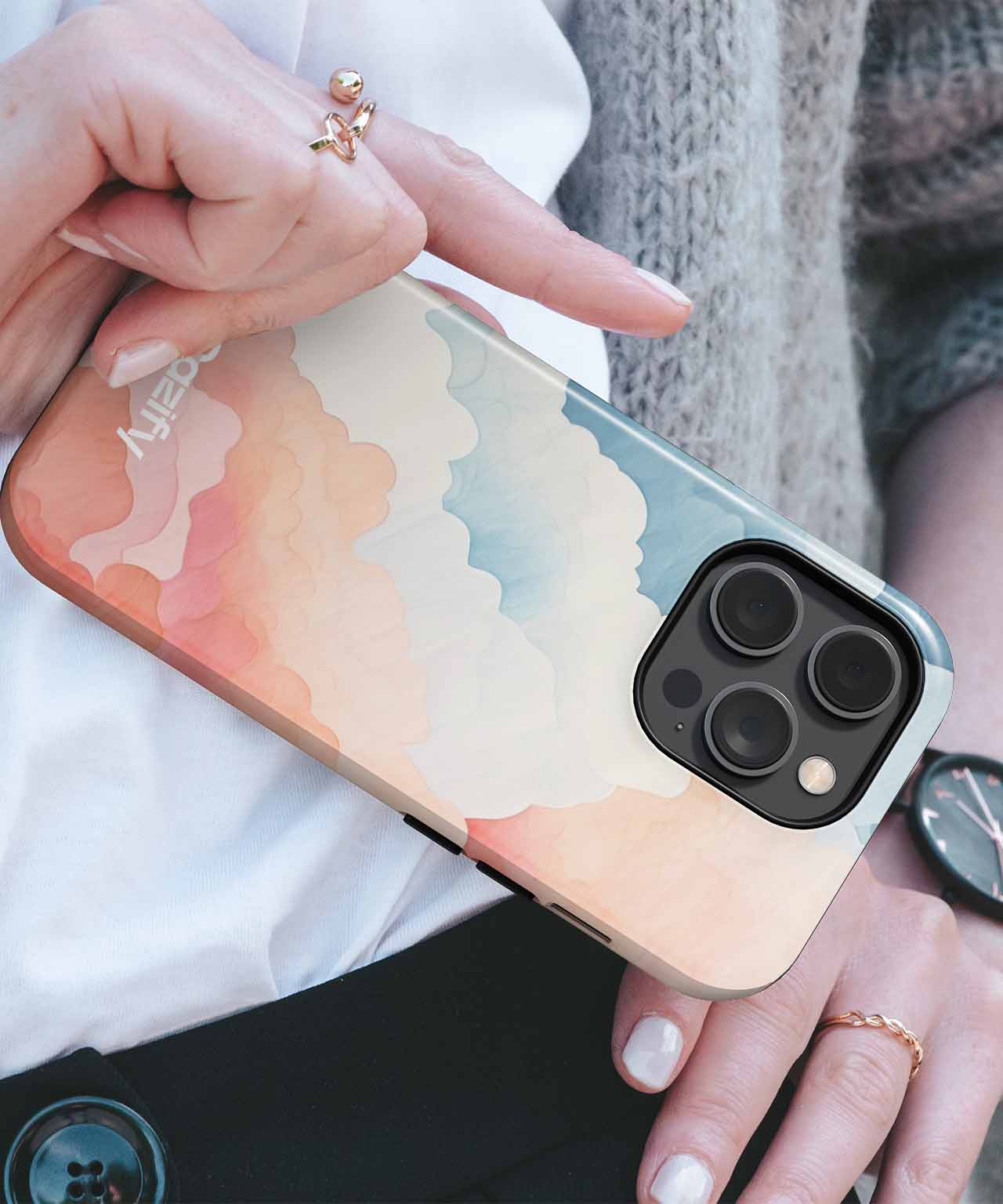 IPhone with pastel abstract cloud design case in soft peach, blue, and cream tones. - Cazify Canada
