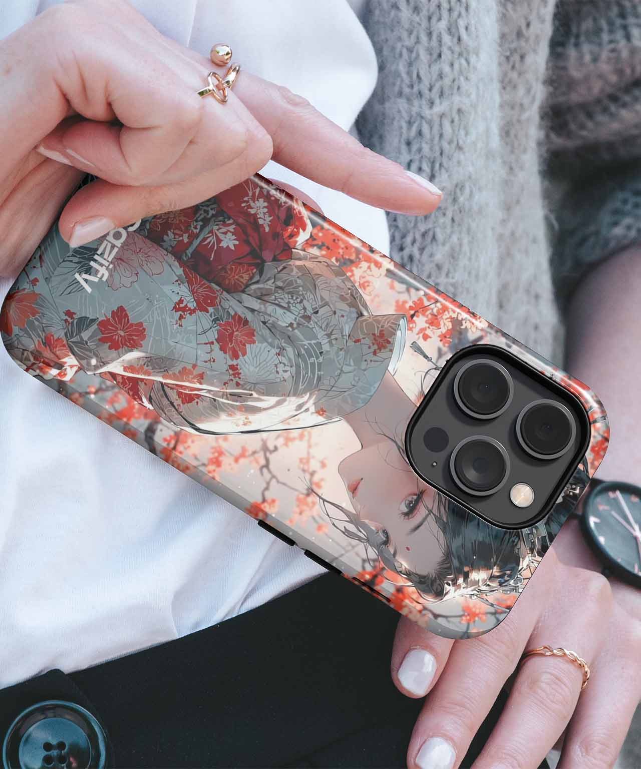 Transparent iPhone case with red and gray floral pattern on a black iPhone. - Elegant Blossom Amidst Vibrant Scenery iPhone case - Cazify Canada