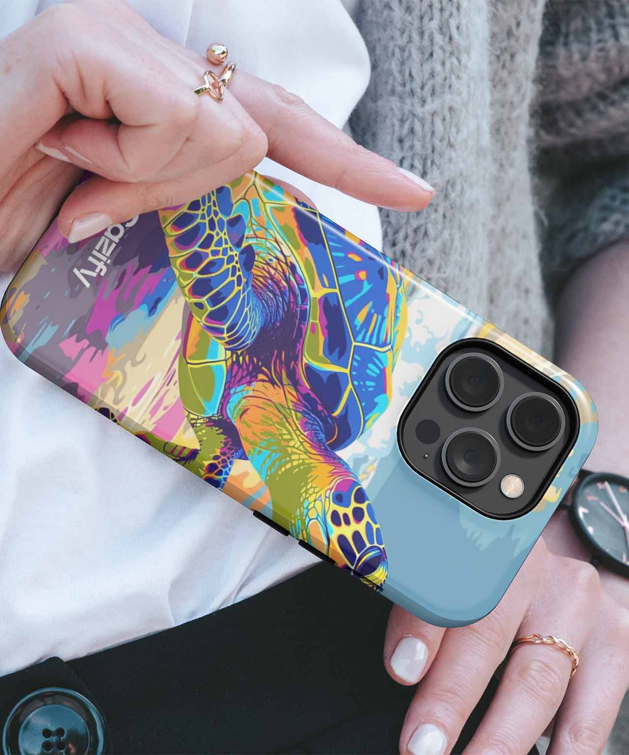 IPhone with colorful, artistic lizard design case and gold-edged camera cutout. - Cazify Canada