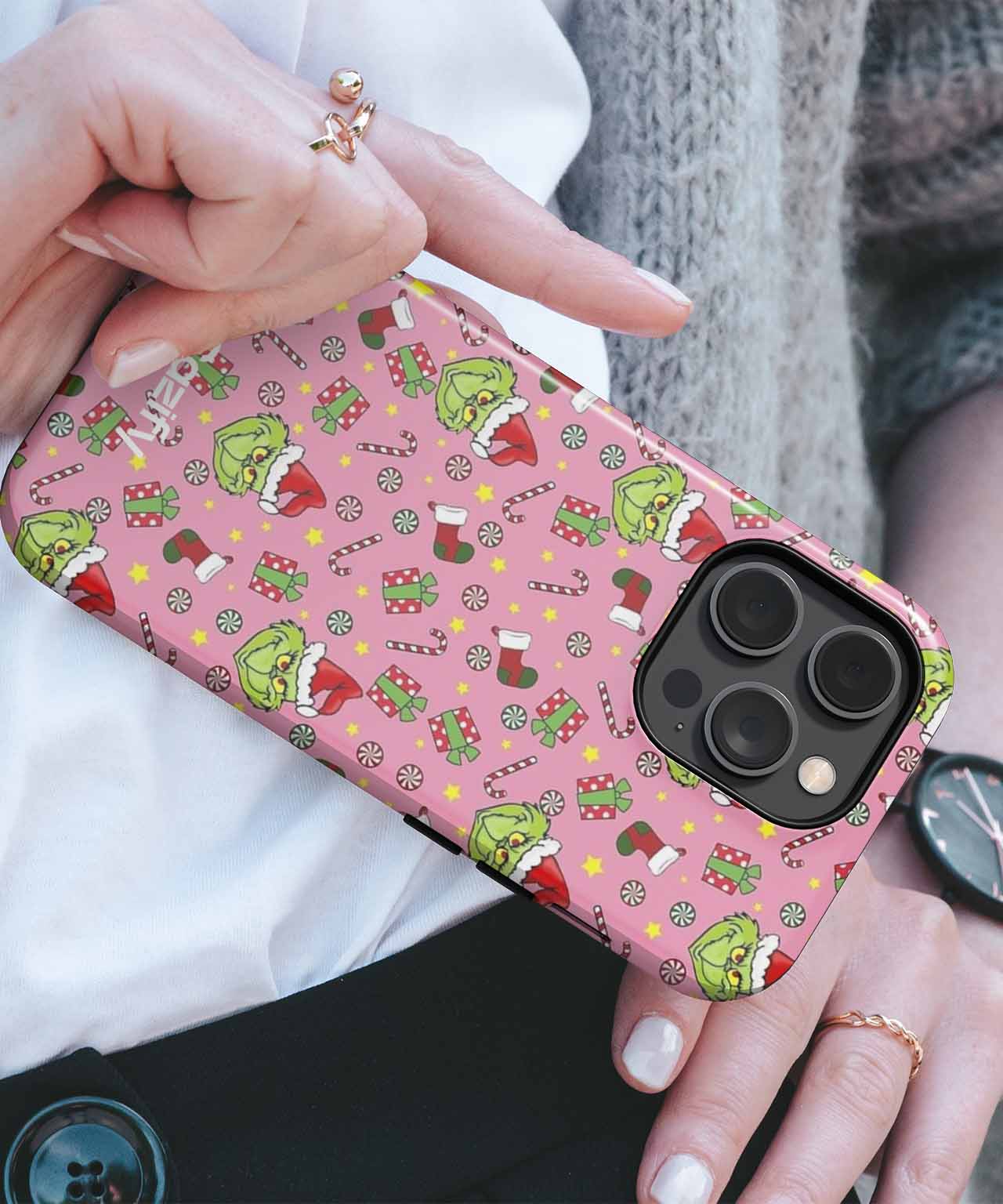 Grinchy Mischief on a Pink Christmas Background iPhone case Case Cazify - Delivery Canada