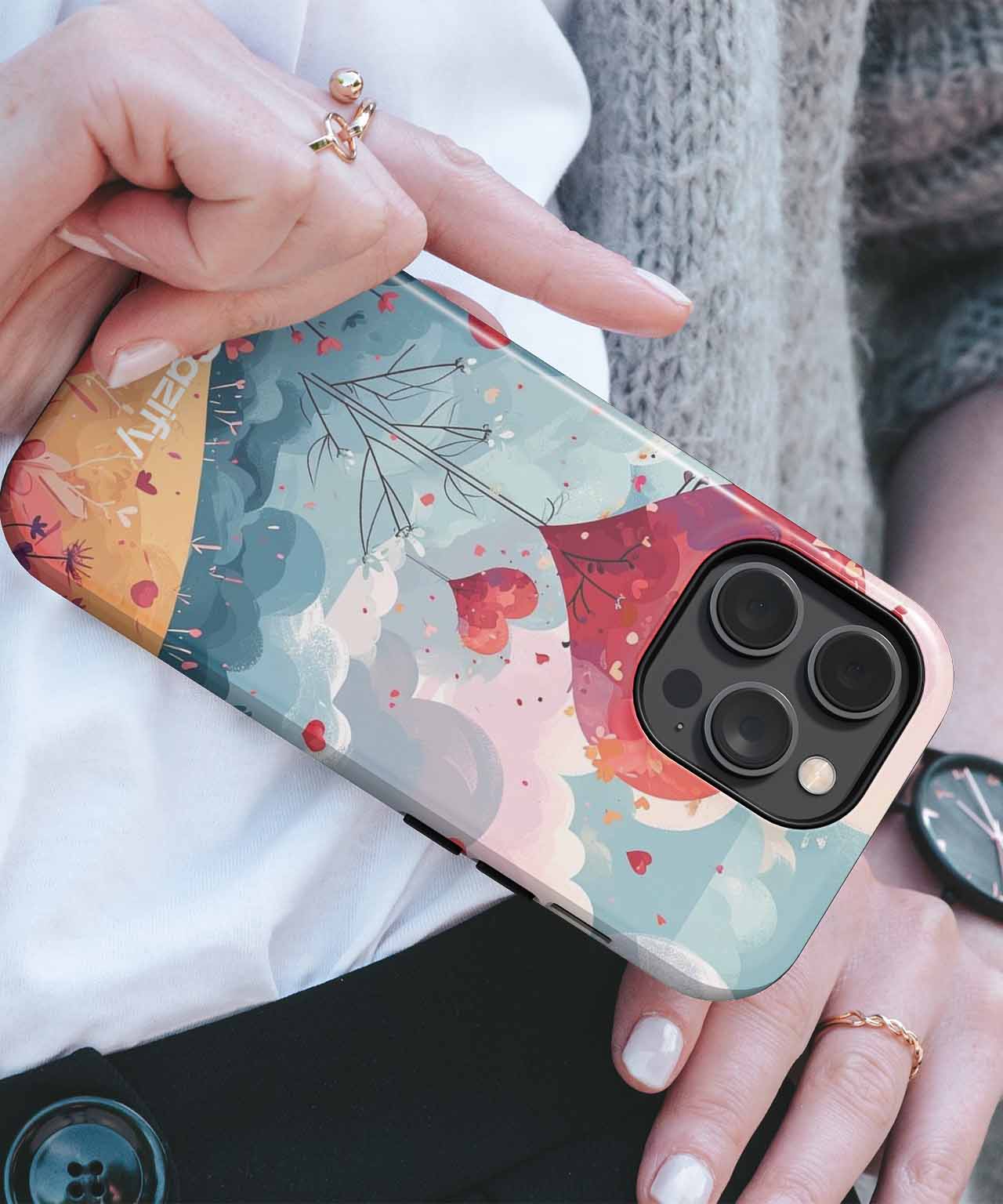 Colorful abstract floral pattern iPhone case with camera cutout, held in hand. - Cazify Canada