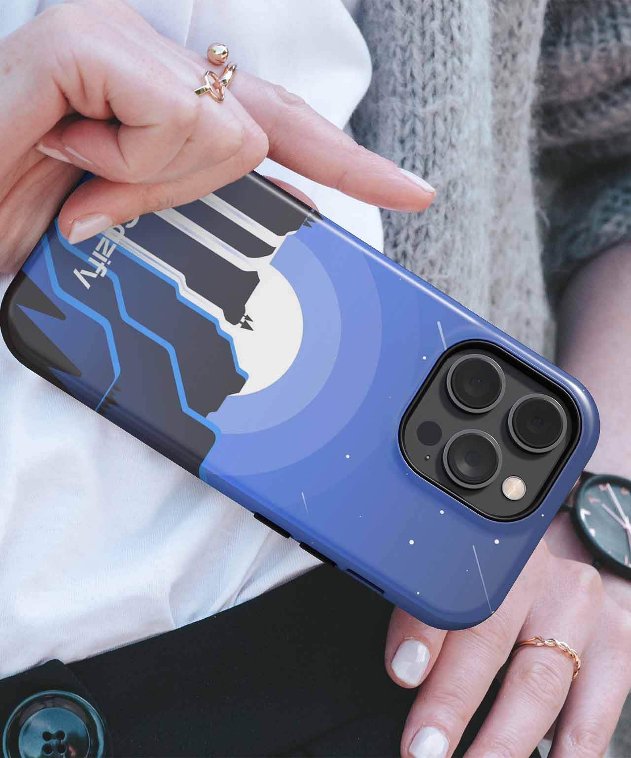 Cazify Canada - Blue phone case with black and white northern lights design on an iPhone with triple camera lenses.