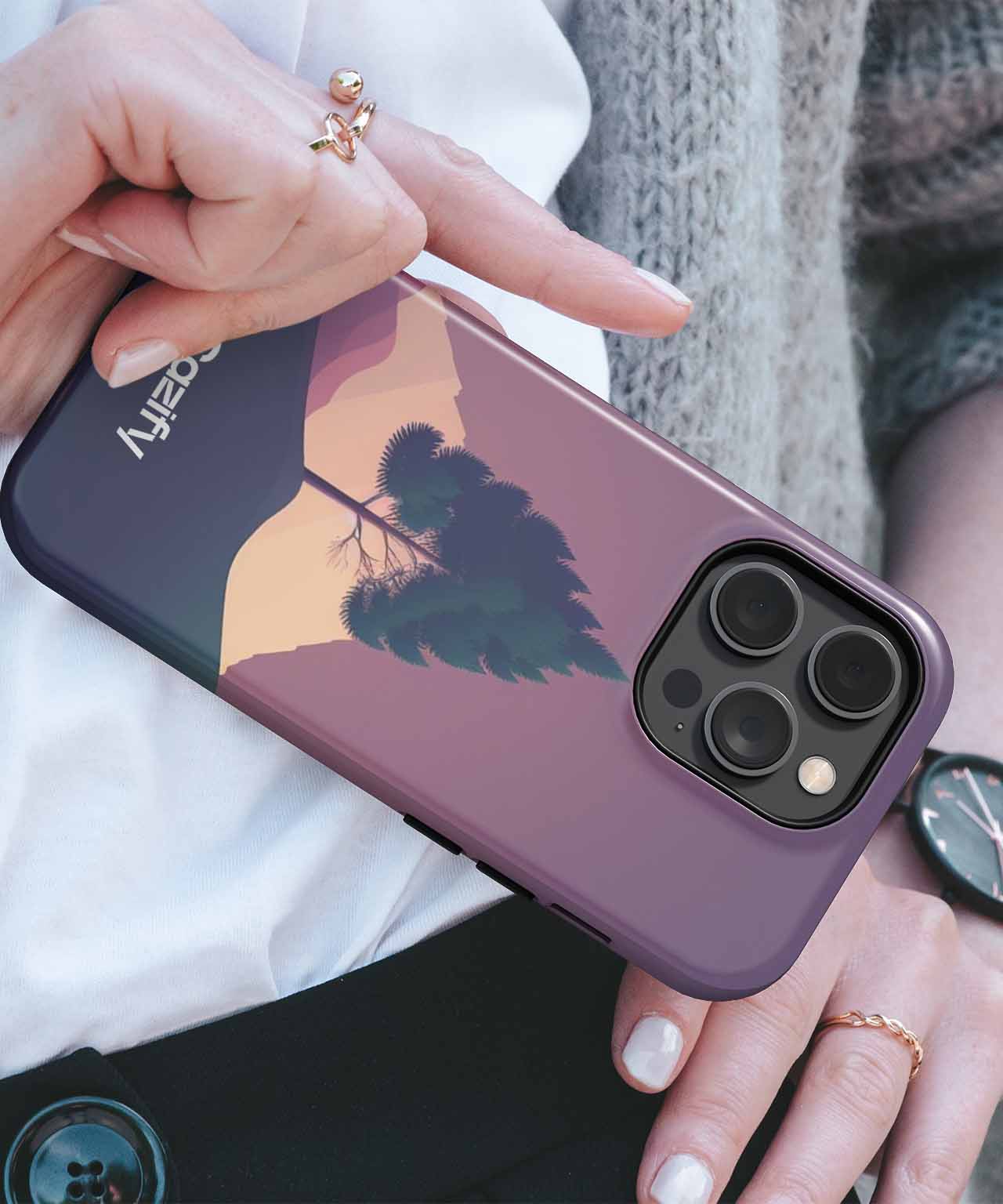Cazify Canada - Purple iPhone case with palm tree silhouette and sunset design on back.