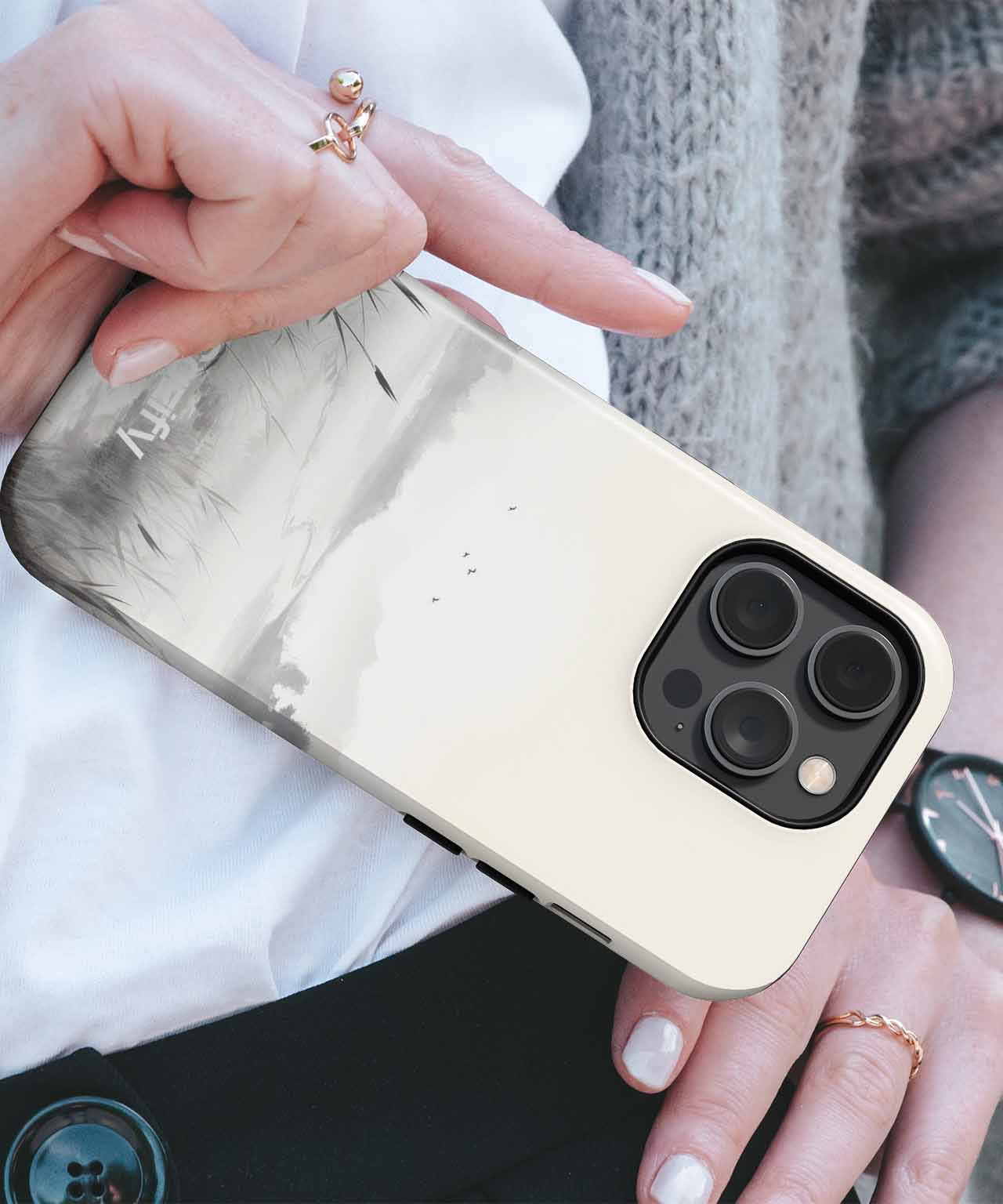 Cazify Canada - Glossy beige phone case with a marble pattern and black triple camera cutout on smartphone.