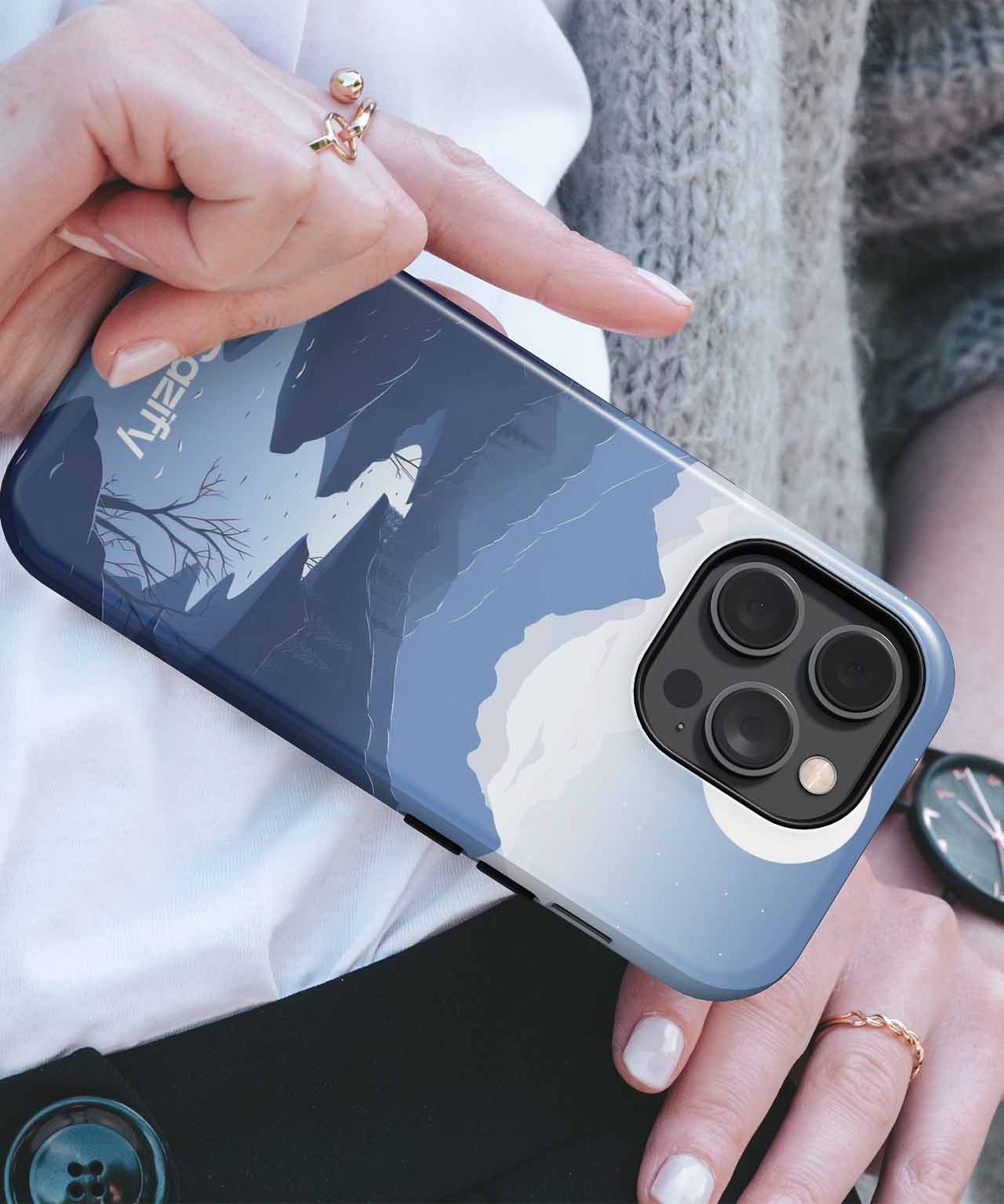 Cazify Canada - Blue and gray mountain-themed phone case with camera cutout on hand.