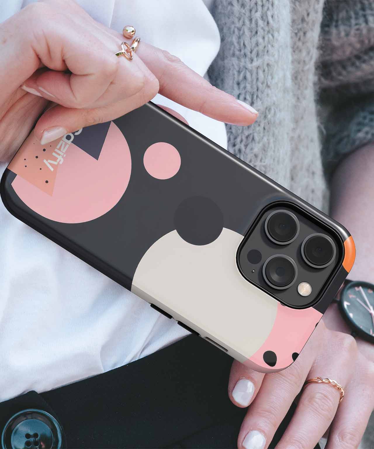 Black iPhone case with abstract pink, beige, and gray geometric shapes and camera cutout. - Cazify Canada