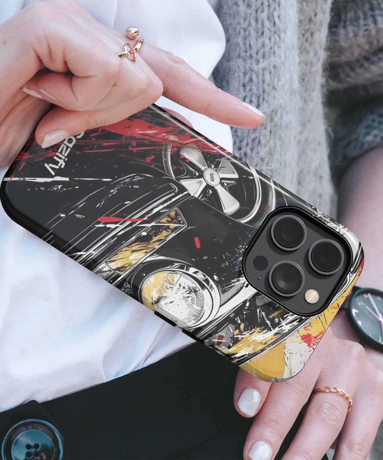 Black iPhone case with abstract vintage car and wheel design with red and yellow accents. - Cazify Canada