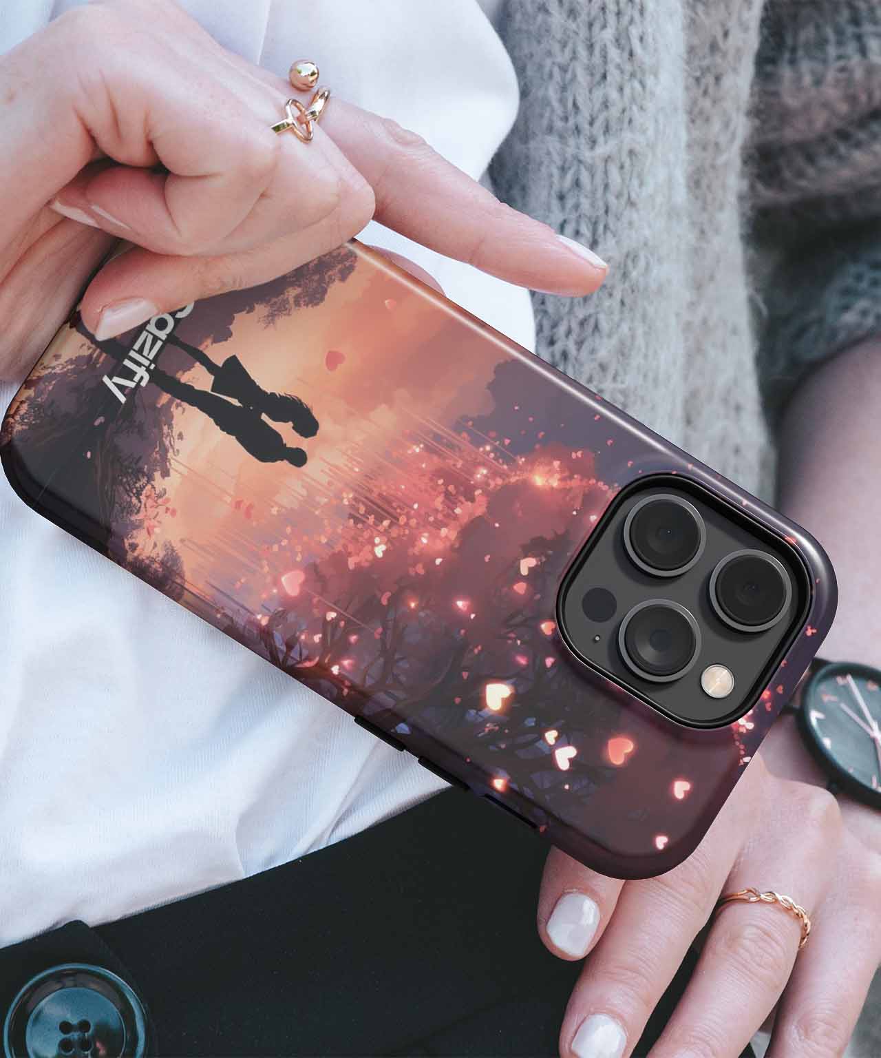 IPhone with dark theme case featuring silhouette and fiery orange sparks design. - Cazify Canada