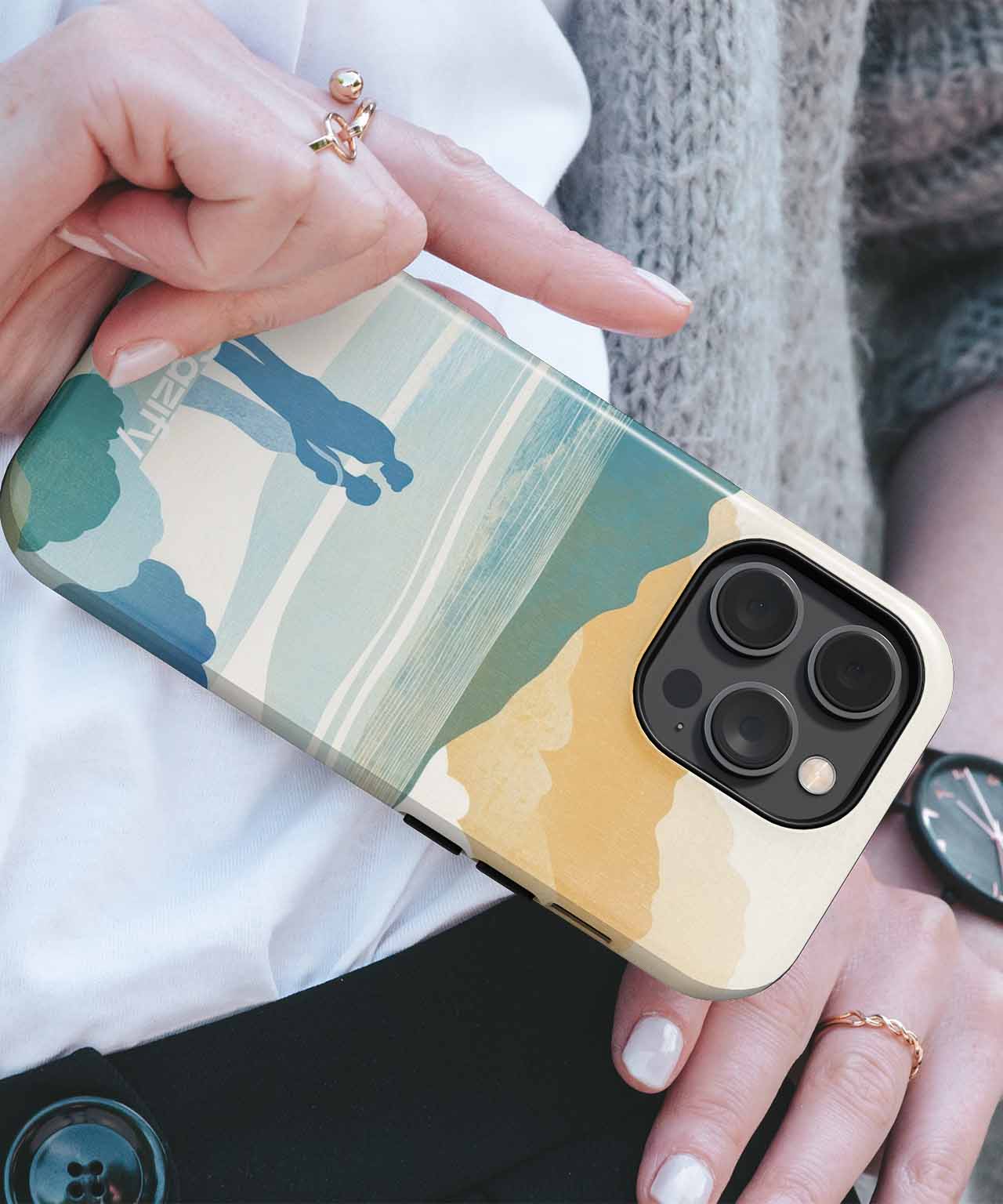 Phone case with abstract landscape design in green, beige, and tan on an iPhone with triple camera lenses. - Cazify Canada