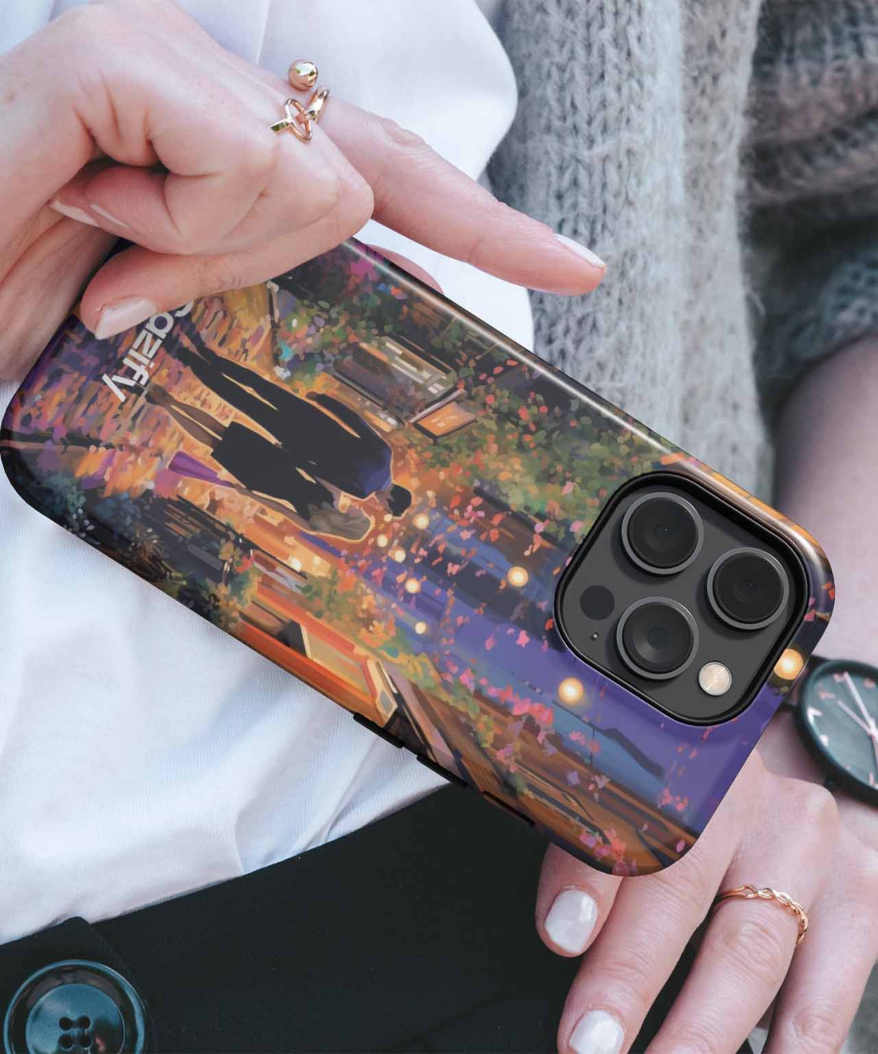 Black iPhone case with colorful cityscape and couple silhouette design, glossy finish. - Cazify Canada