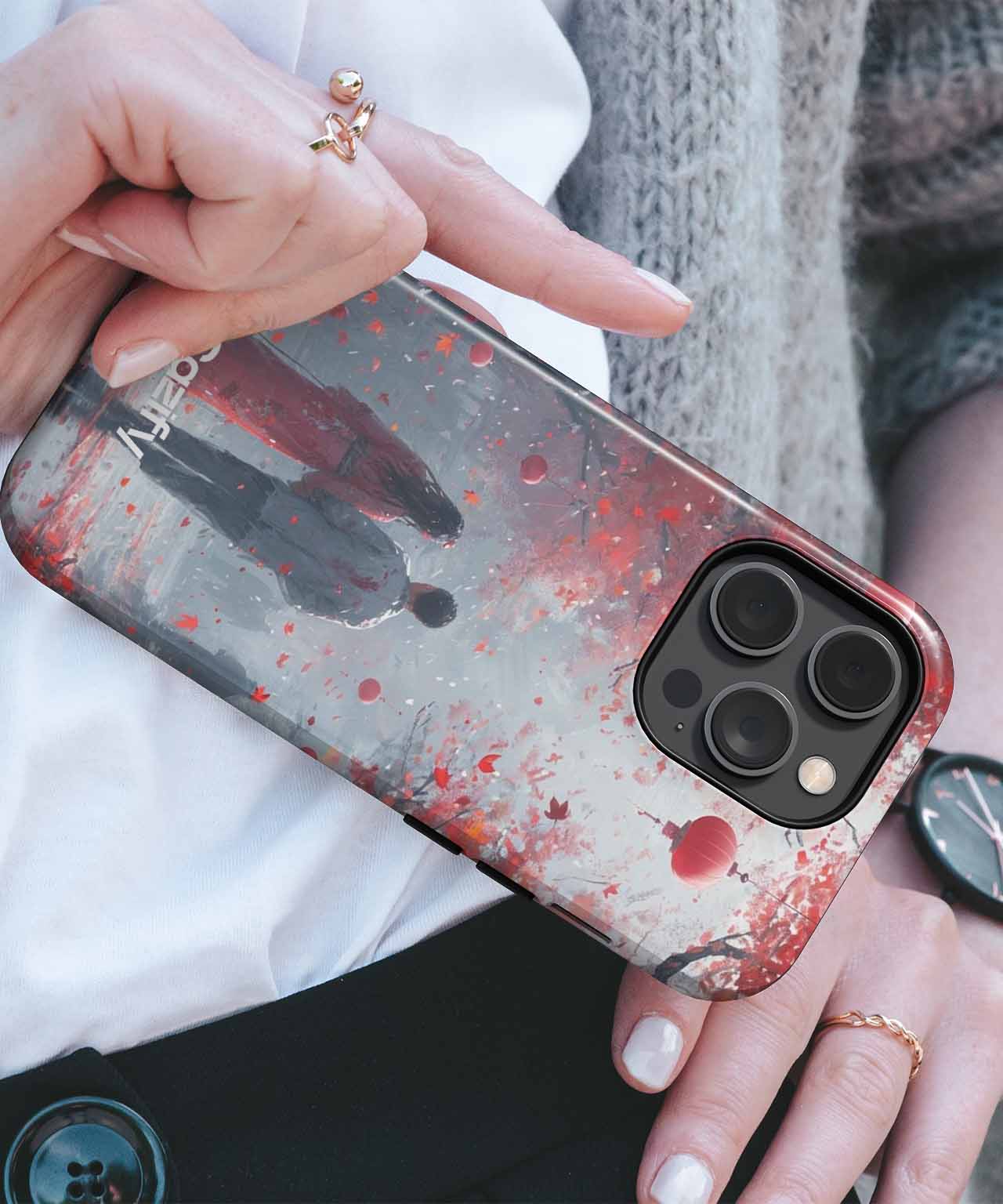 Transparent phone case with red splatter and dark silhouette design on an iPhone with triple camera lenses. - Cazify Canada