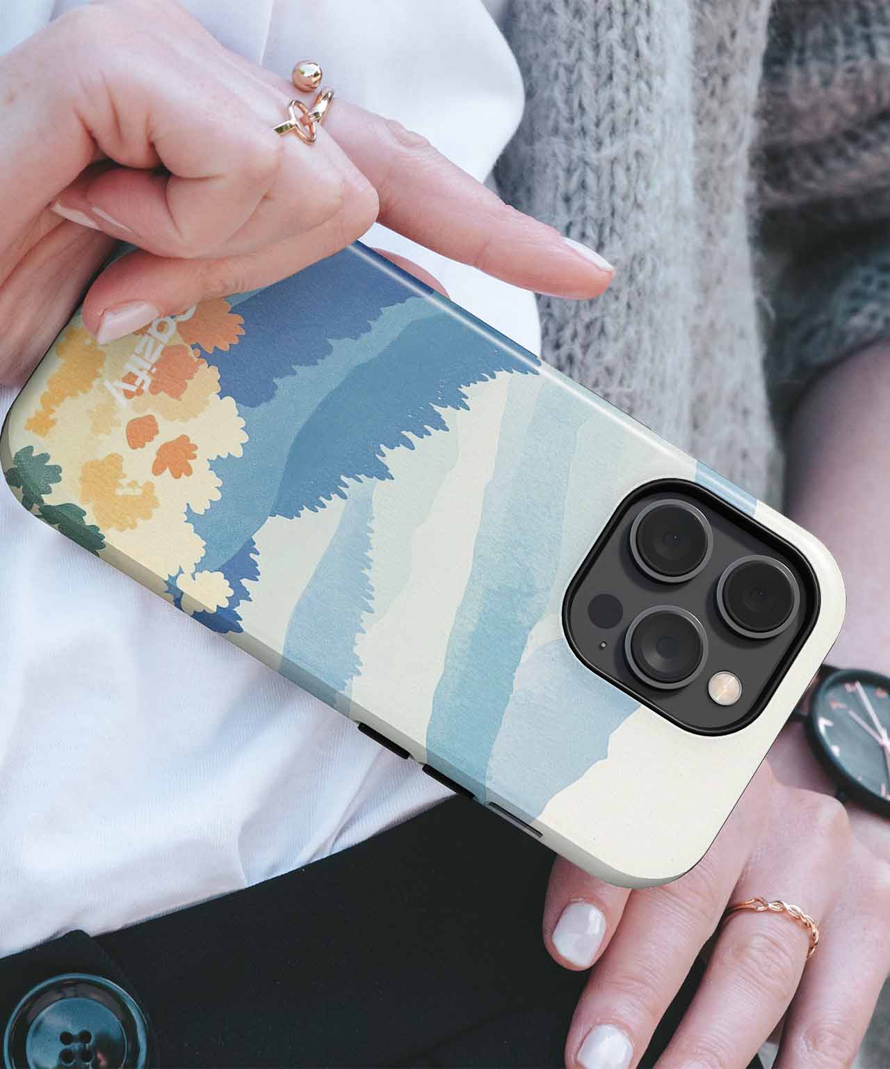 Cazify Canada - Floral abstract art phone case with blue, cream, and yellow tones on iPhone Pro Max.