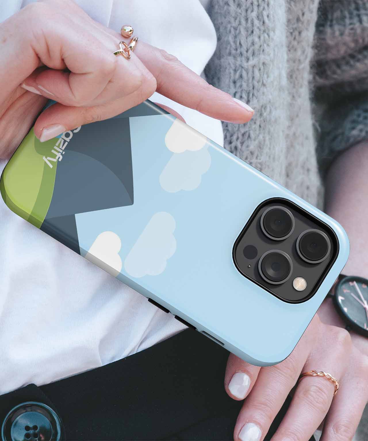 Cazify Canada - Light blue iPhone case with cartoon clouds and green hill design, triple camera cutout.