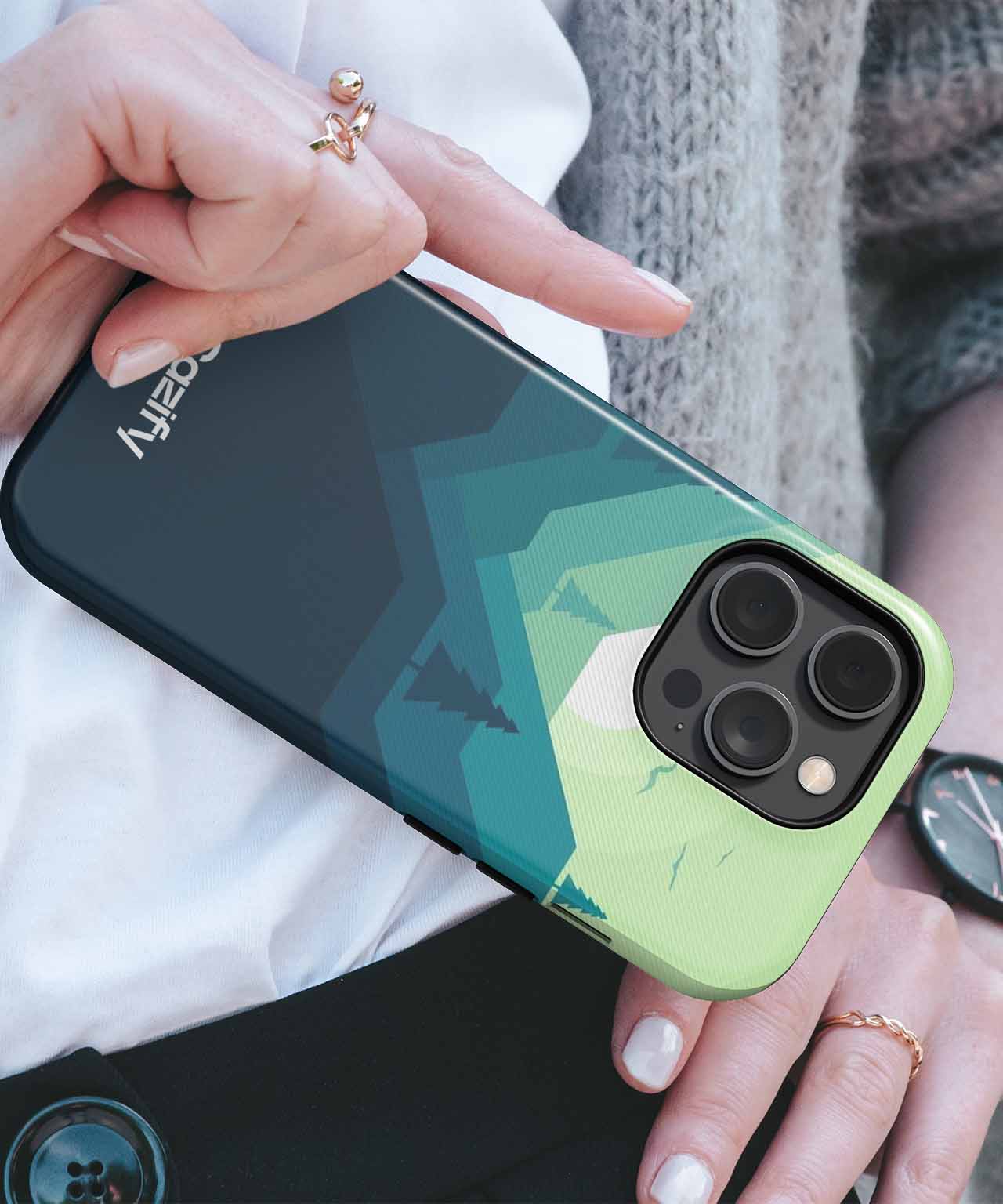 Cazify Canada - Green and black geometric-patterned iPhone case with triple camera cutout on an iPhone Pro model.