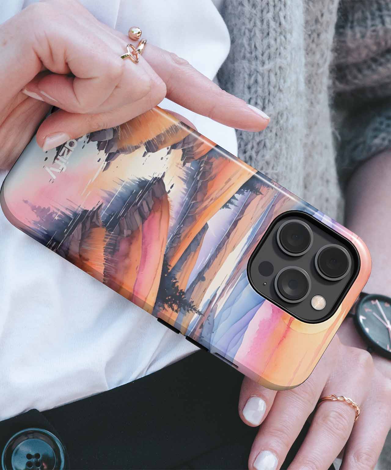 Cazify Canada - IPhone with colorful abstract sunset mountain landscape case and black triple camera cutout.