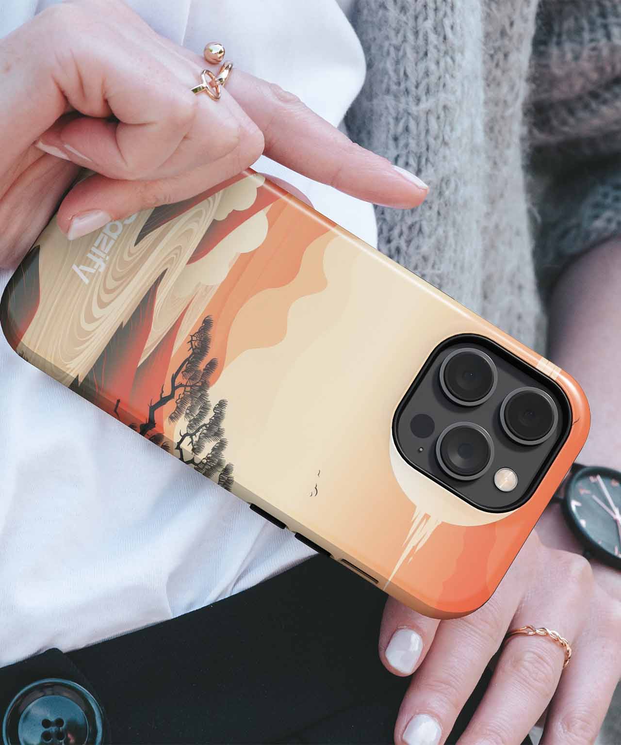 Cazify Canada - IPhone case with orange and beige desert landscape design and black camera cutout.