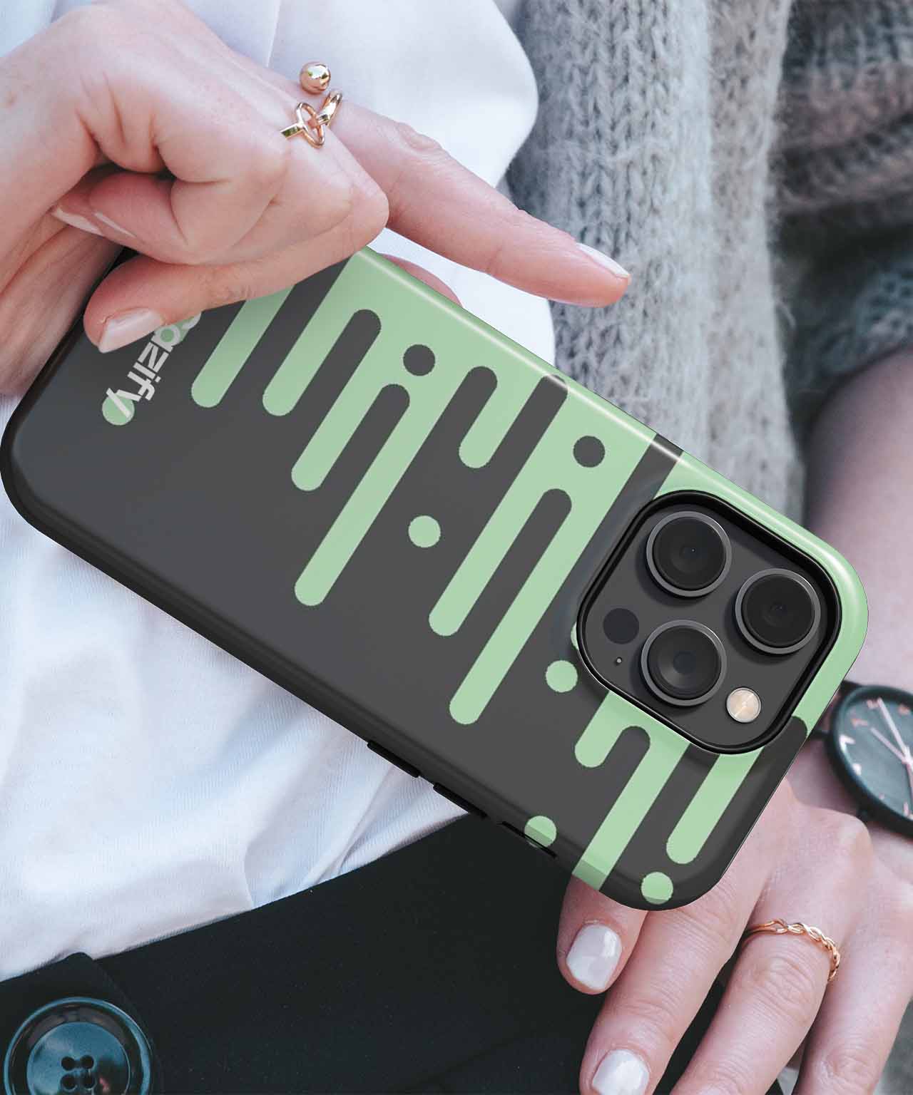 Black iPhone case with green dripping paint design and triple camera cutout. - Cazify Canada