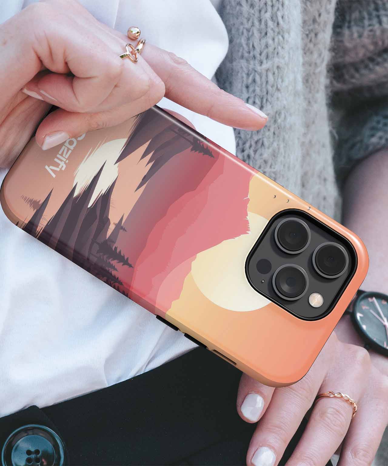 Cazify Canada - Gradient sunset landscape design on iPhone case with black camera cutout and orange edges.