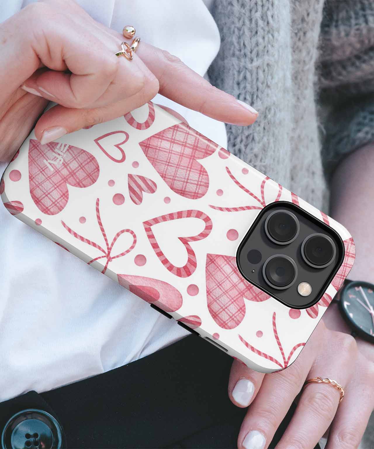Cream phone case with red hearts and polka dots pattern on a smartphone. - Cazify Canada