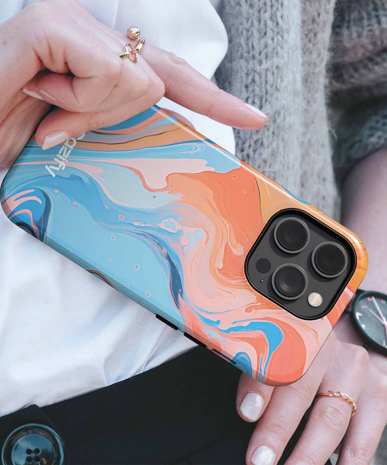 Colorful abstract swirl design phone case with cutouts for triple camera lenses on an iPhone. - Cazify Canada