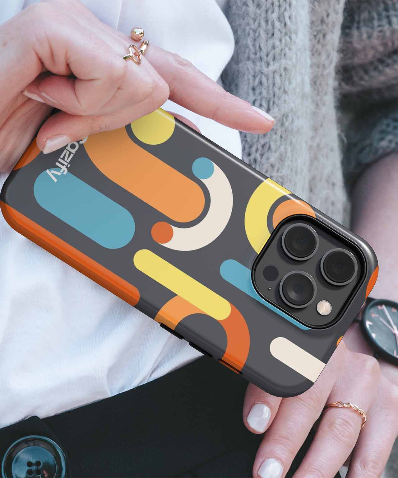 IPhone case with abstract retro shapes in orange, teal, cream, and brown colors. - Cazify Canada