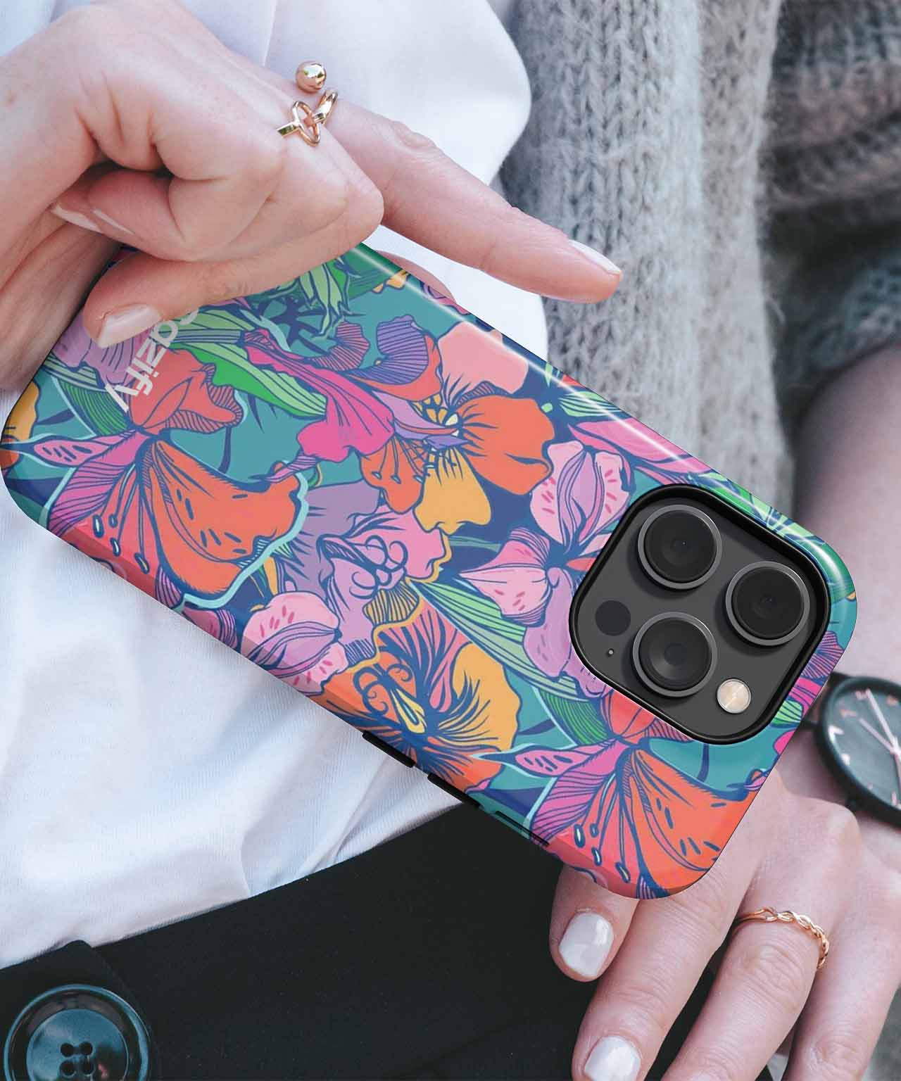 Floral patterned phone case with pink, orange, and purple flowers on a dark background, fitted on a black iPhone. - Cazify Canada