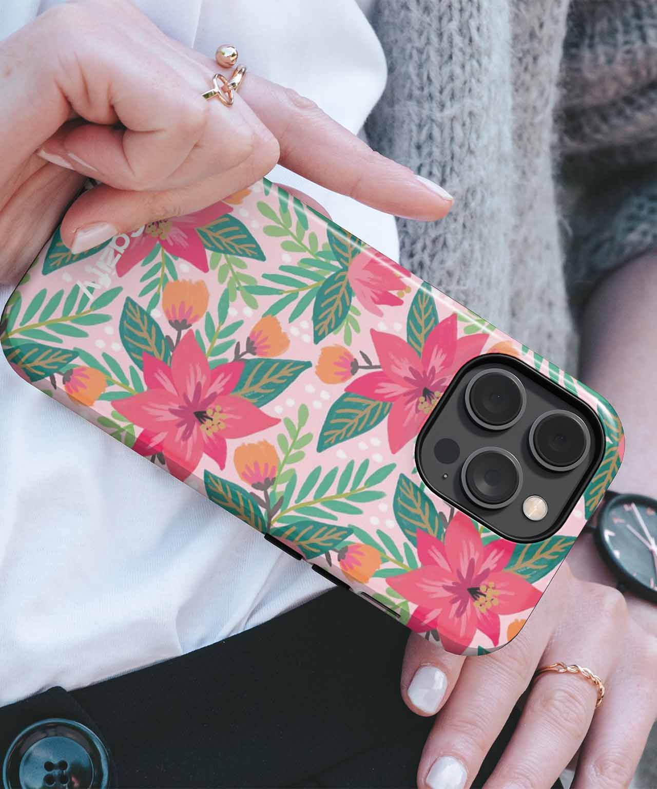 Floral pink and green leaf patterned phone case on black iPhone with triple cameras. - Cazify Canada