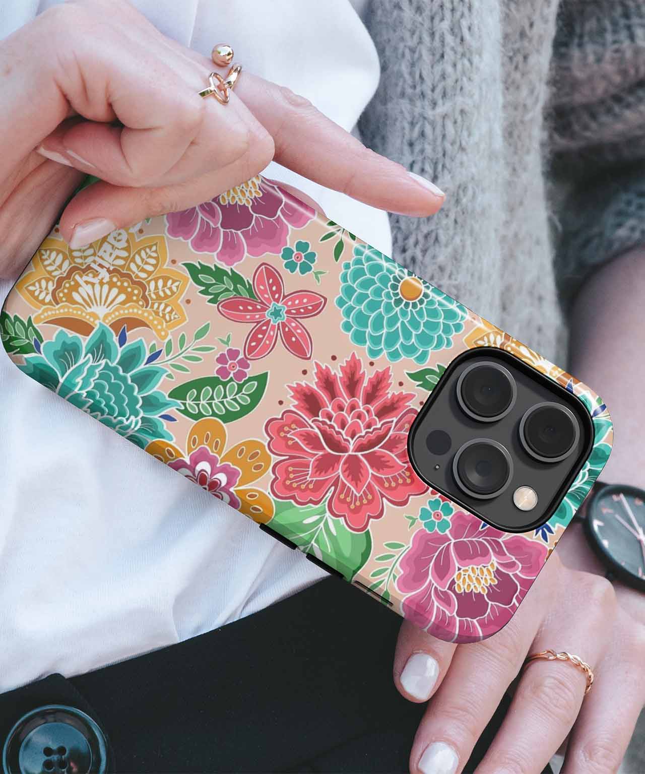 Floral patterned phone case with vibrant pink, red, green, and yellow flowers on smartphone. - Cazify Canada
