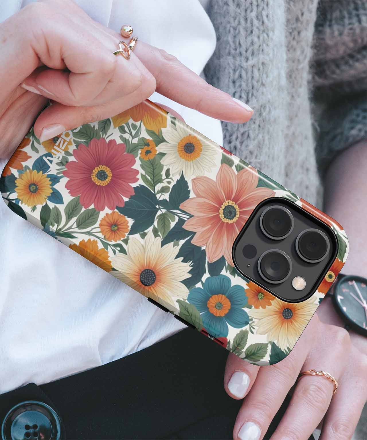Floral pattern iPhone case with large colorful flowers and green leaves on a black background. - Vibrant Floral Symphony with Cheerful Blooms iPhone case - Cazify Canada