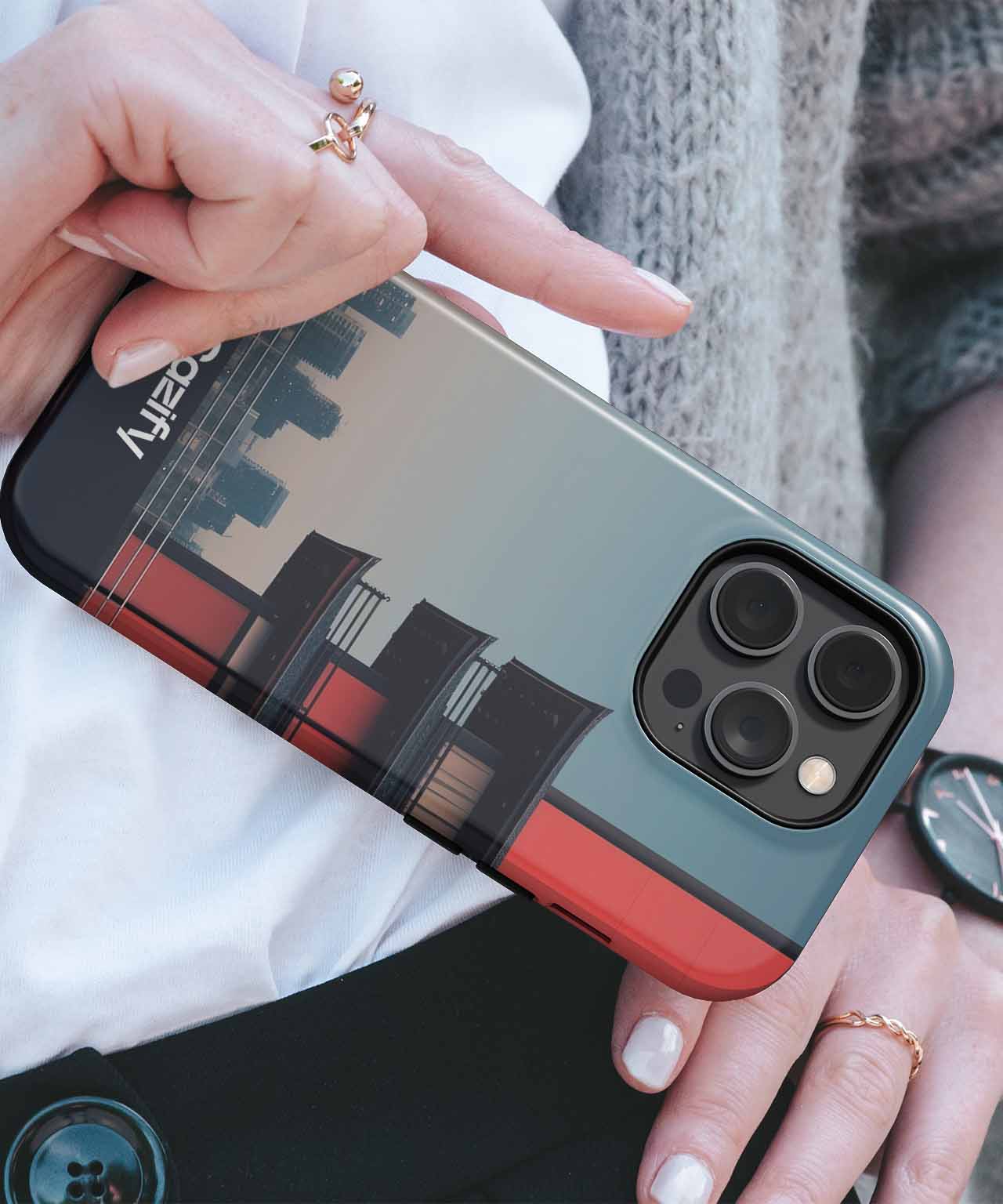 IPhone with city skyline and sunset graphic case featuring three camera lenses. - Cazify Canada